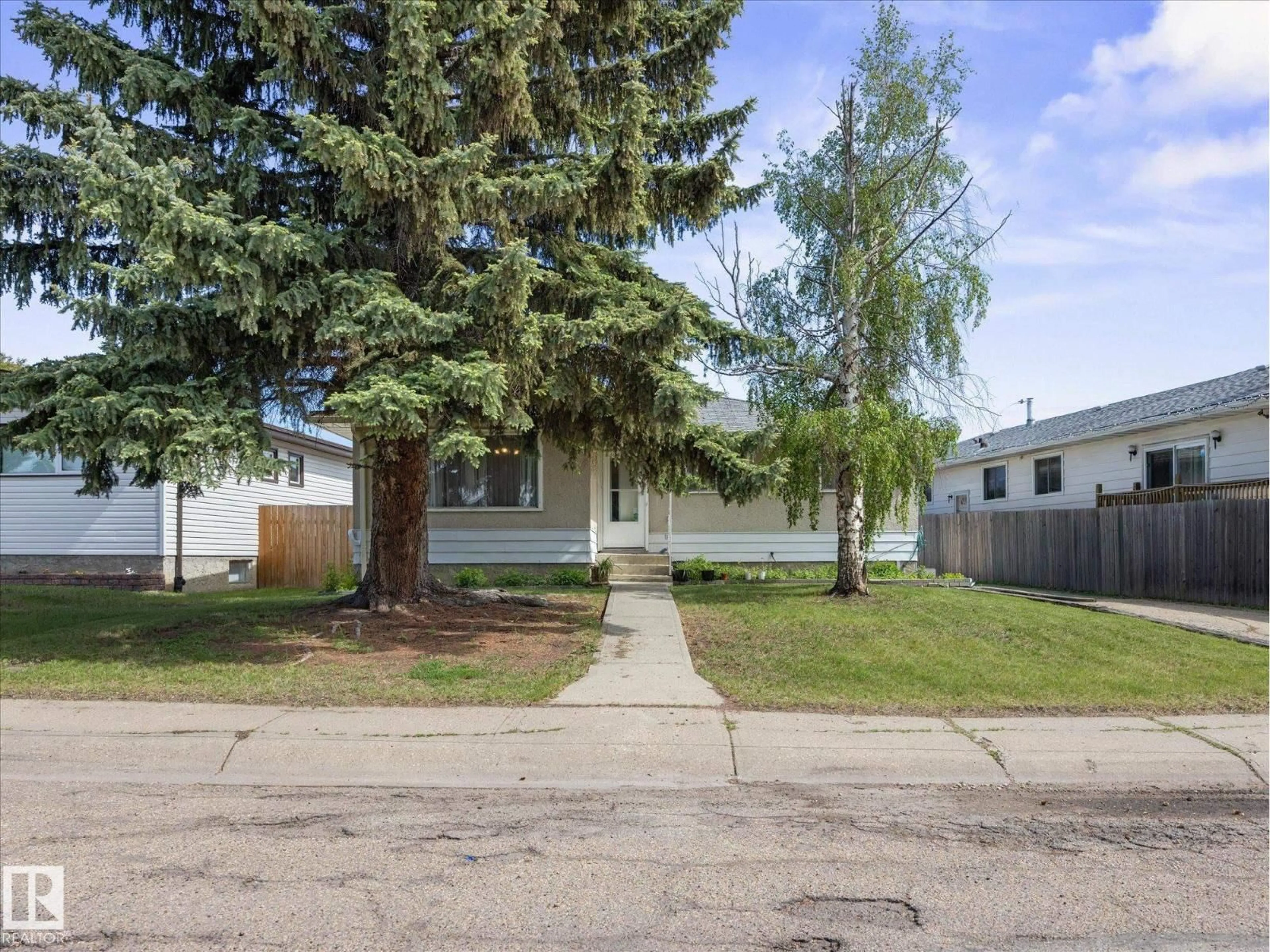 Home with vinyl exterior material, street for NW - 11408 165 AV, Edmonton Alberta T5X3W6