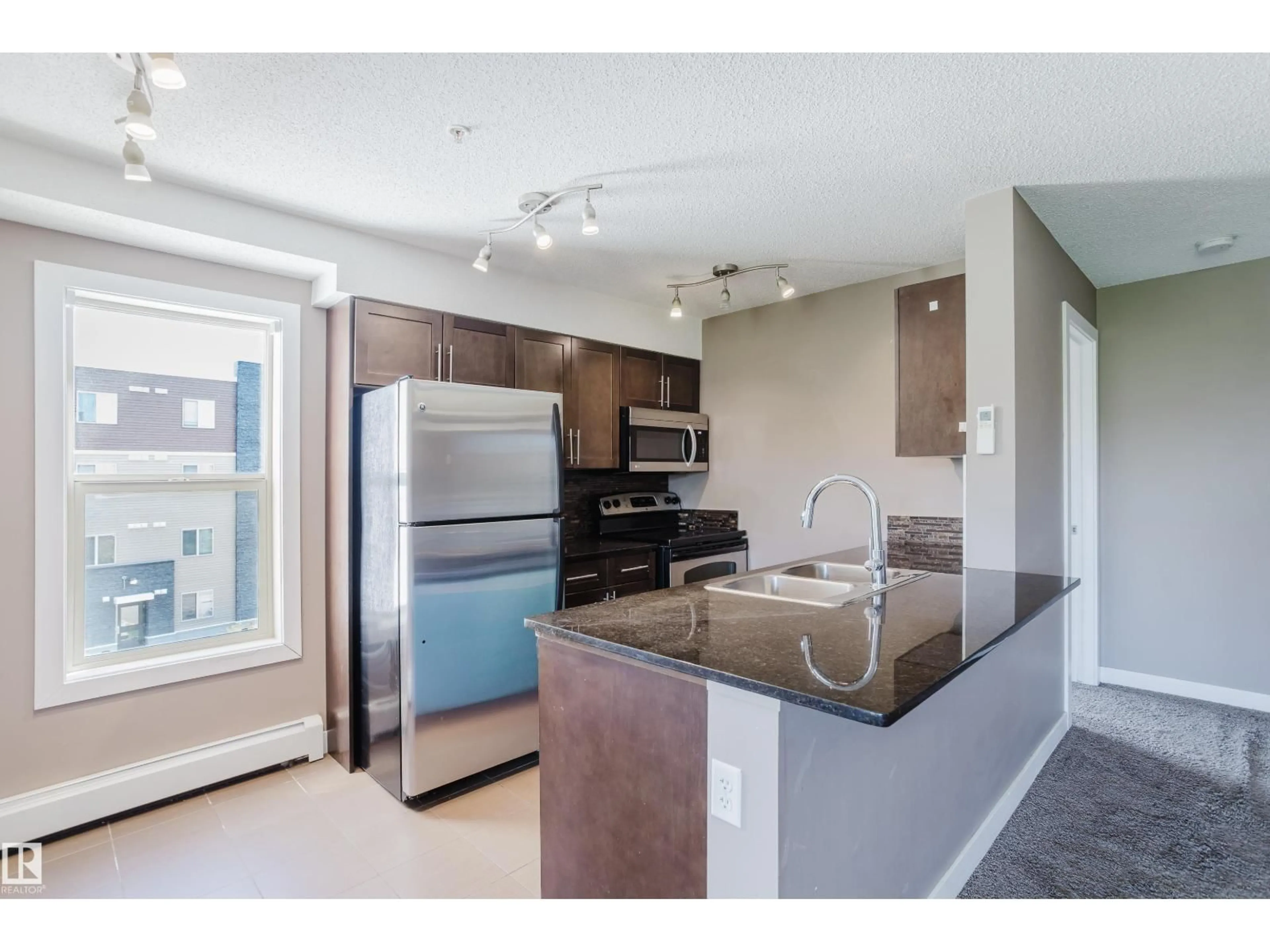 Open concept kitchen, unknown for #301 - 11820 22 AV, Edmonton Alberta T6W2A2