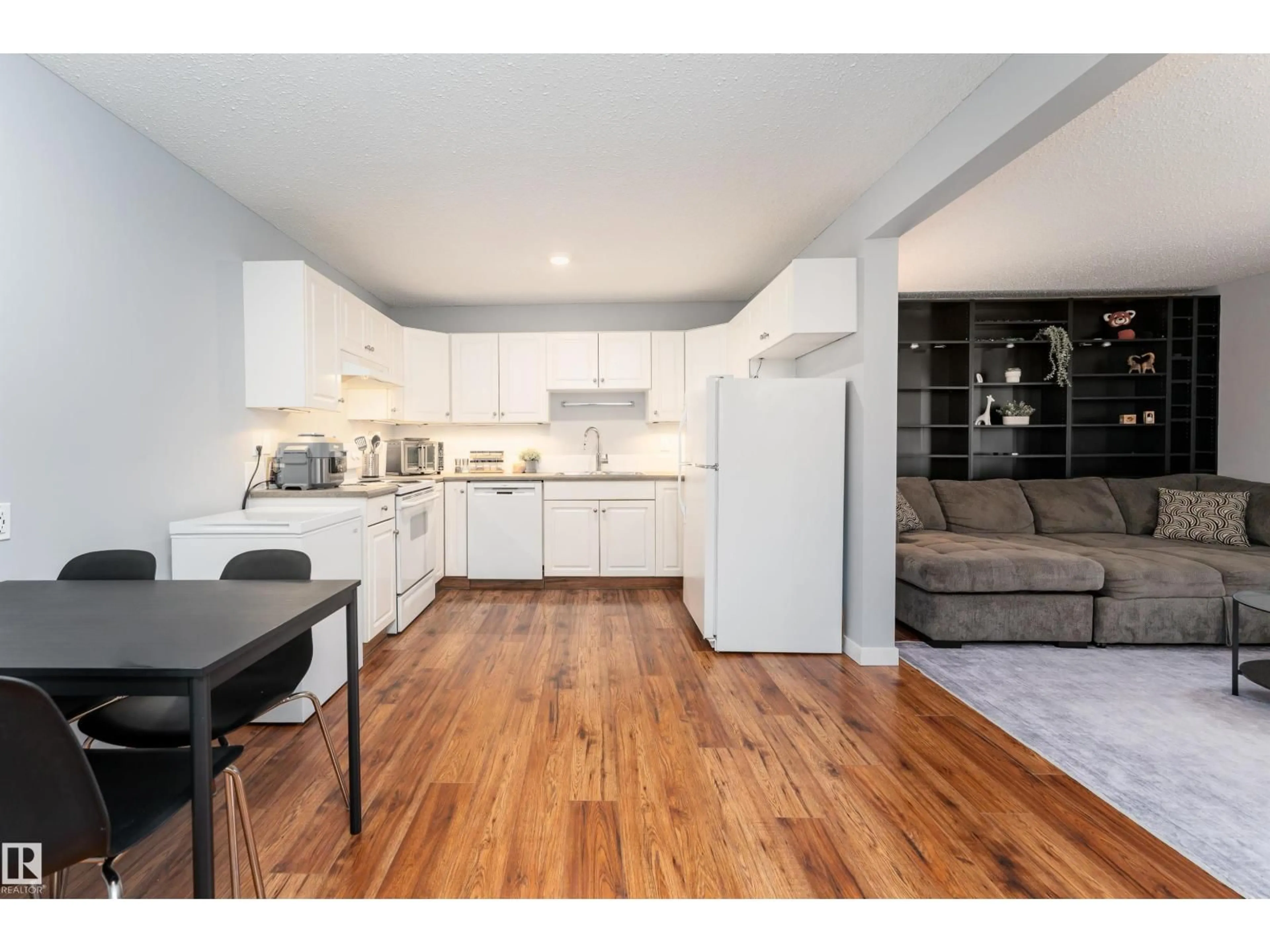 Open concept kitchen, wood/laminate floor for #26 - 10208 113 ST, Edmonton Alberta T5G0W9