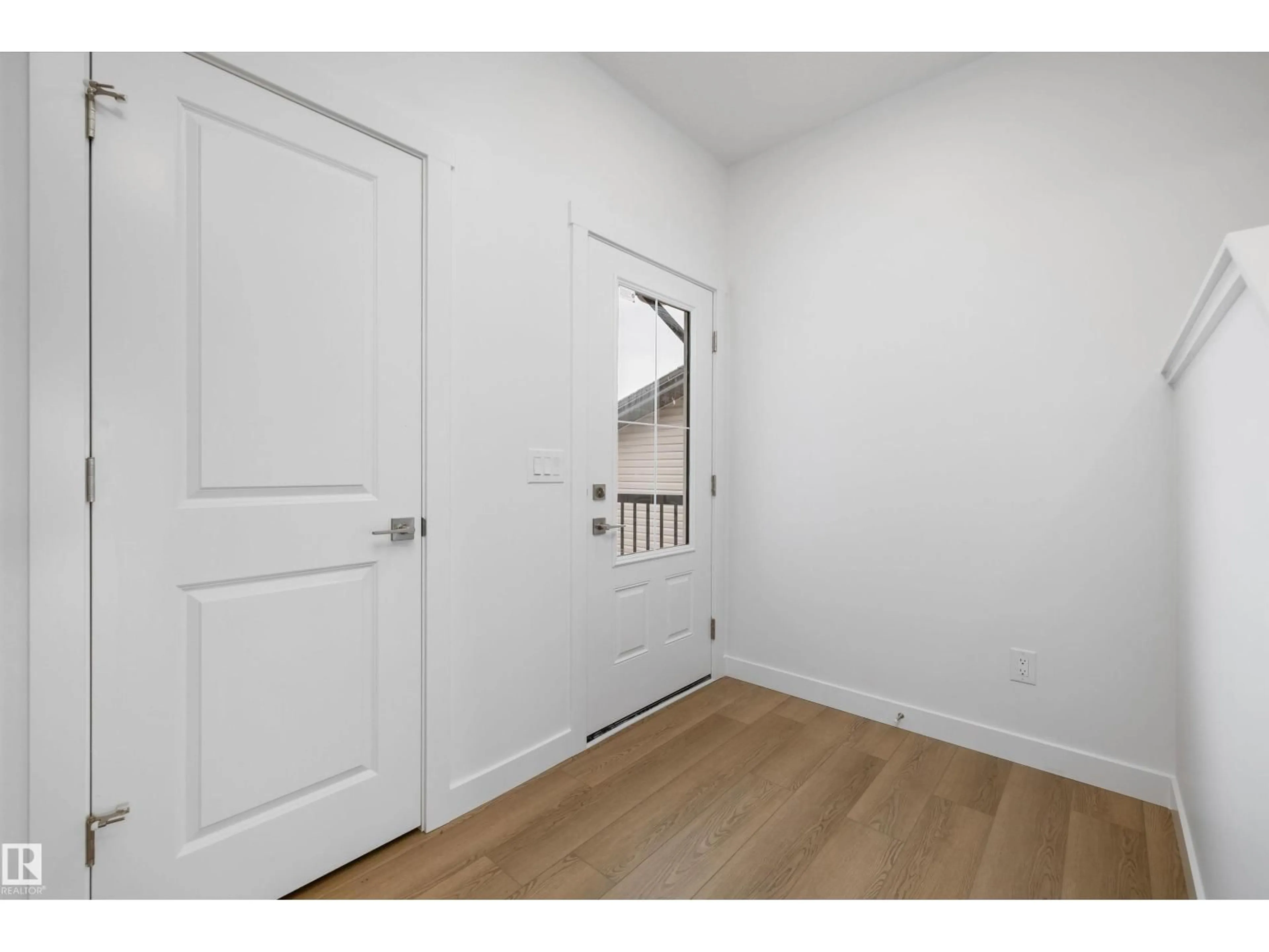 Indoor entryway for 19003 24 AV, Edmonton Alberta T6M3L3
