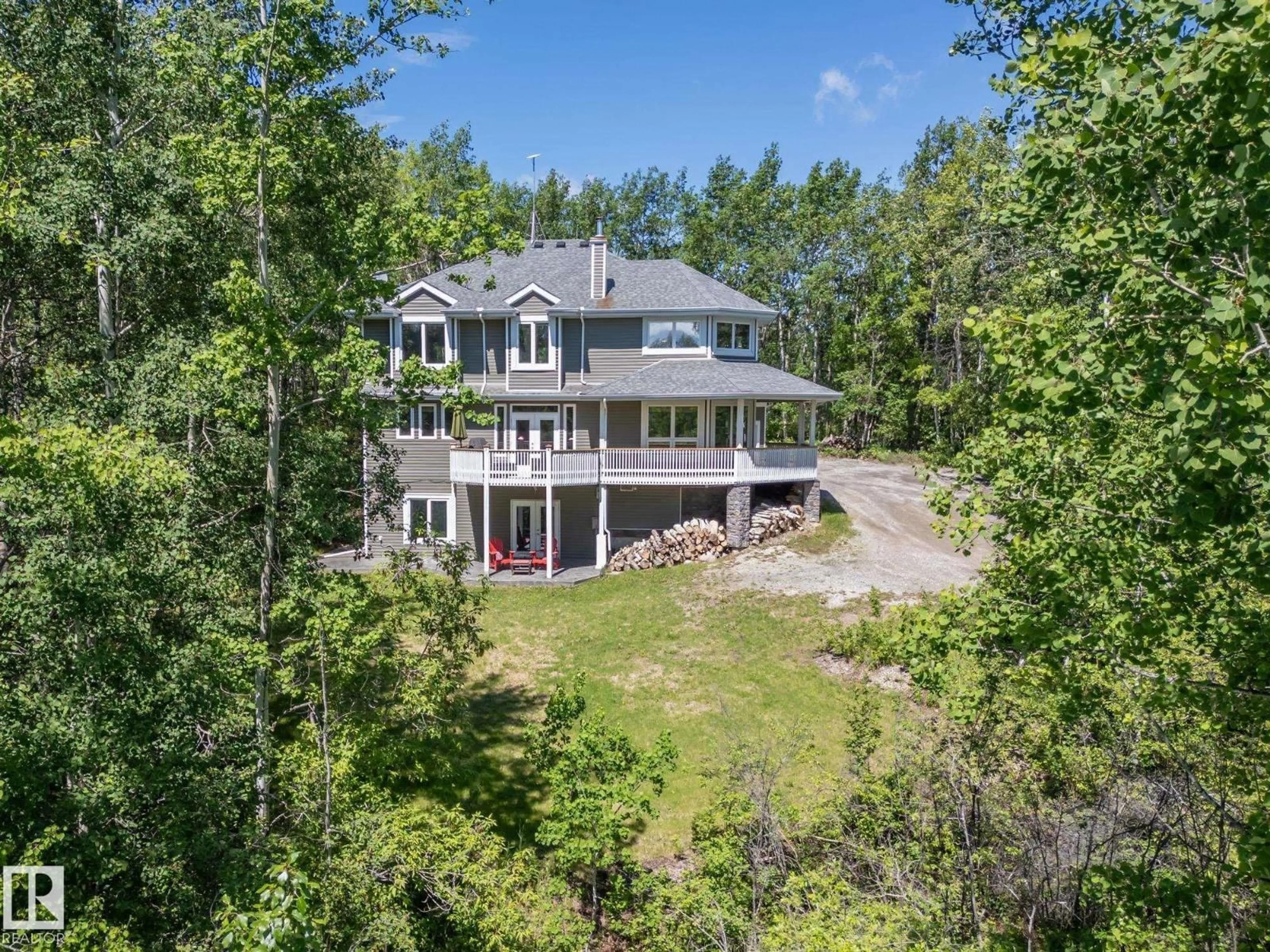 A pic from outside/outdoor area/front of a property/back of a property/a pic from drone, water/lake/river/ocean view for 43 54129 RGE ROAD 275, Rural Parkland County Alberta T7X3S4