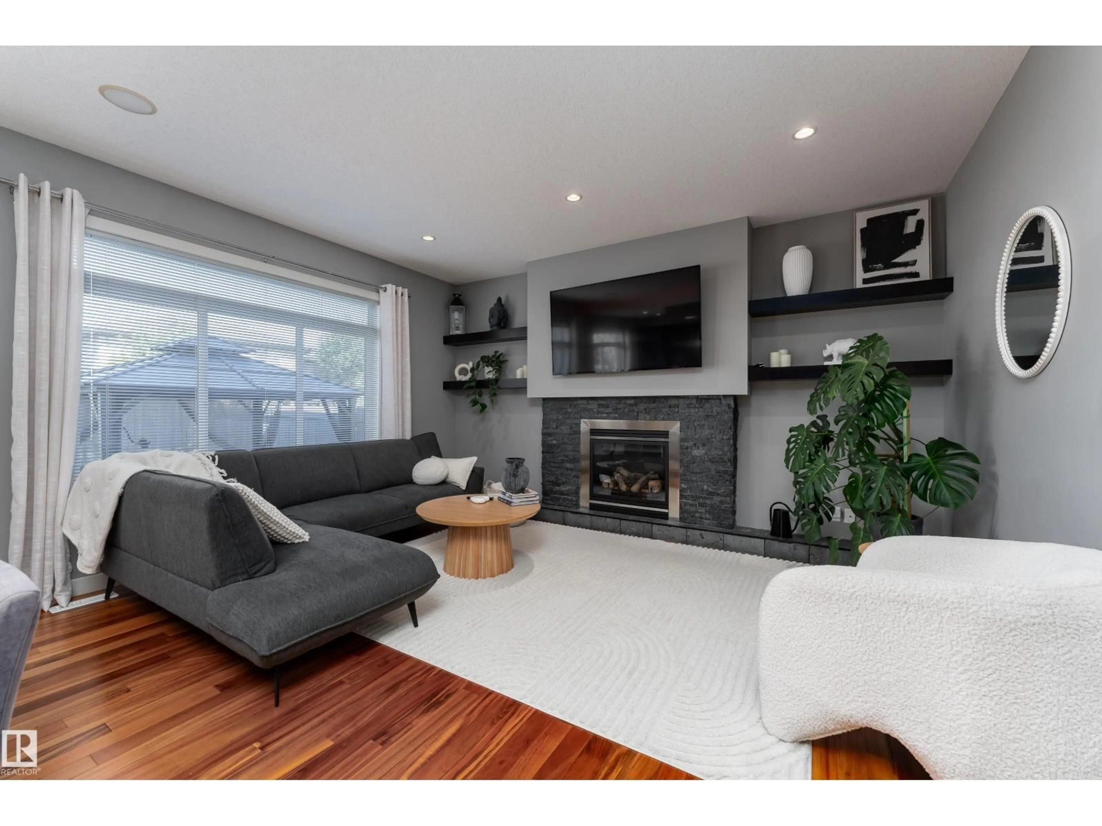 Living room with furniture, wood/laminate floor for 12932 201 ST, Edmonton Alberta T5S0E4