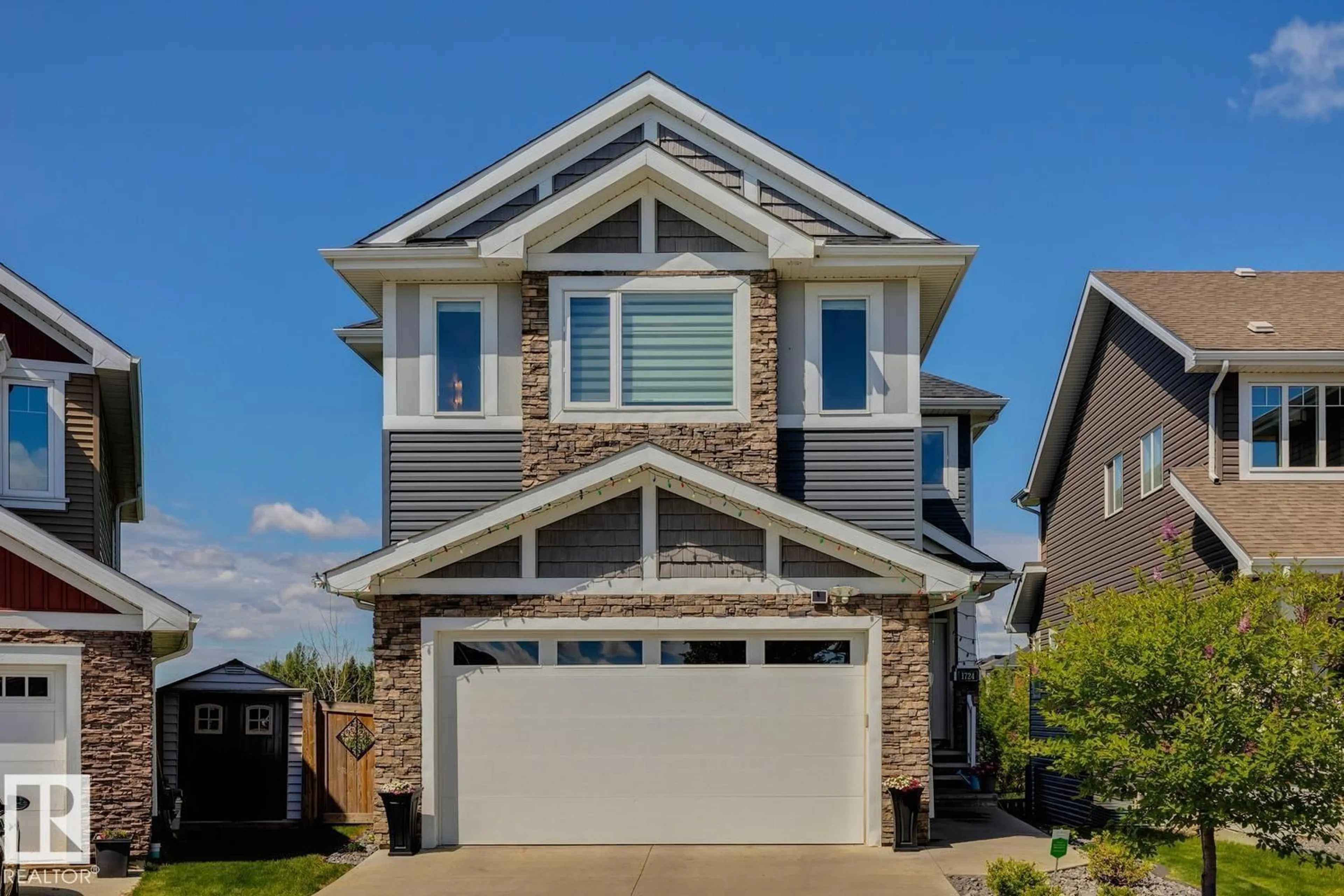 Home with vinyl exterior material, street for SW - 1724 164 ST, Edmonton Alberta T6W3P6