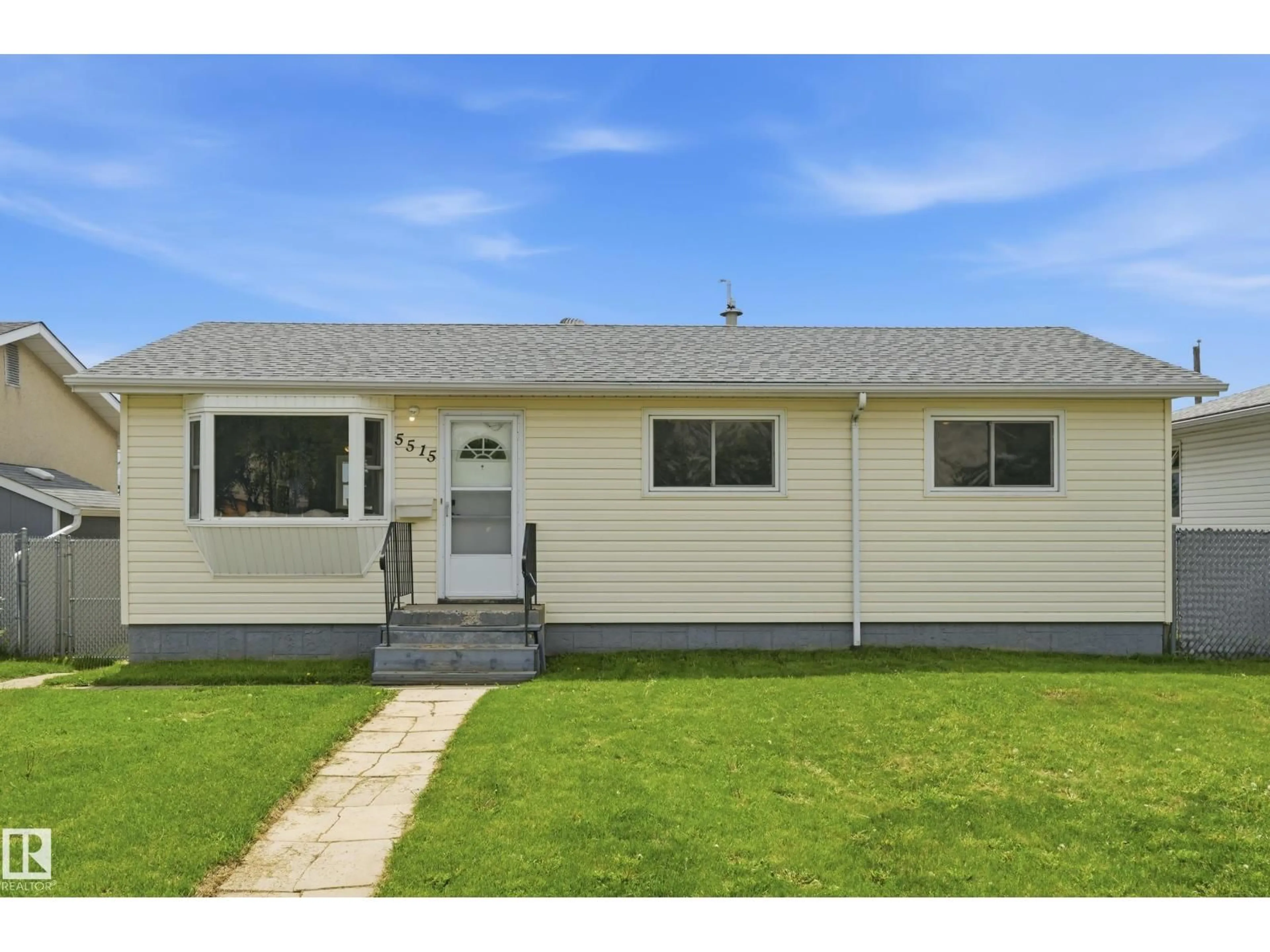 Home with vinyl exterior material, street for 5515 143 AV, Edmonton Alberta T5A1J9