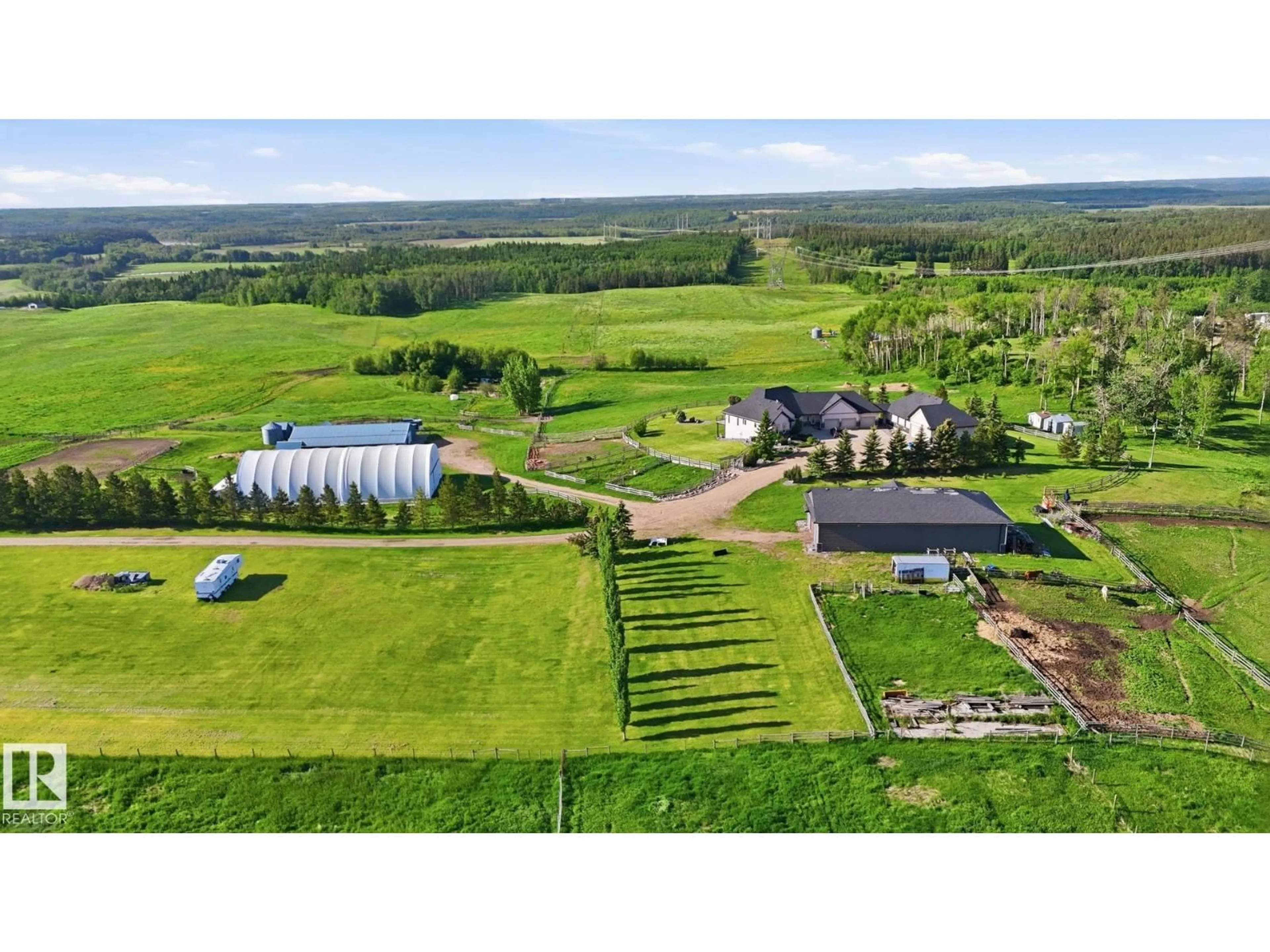 A pic from outside/outdoor area/front of a property/back of a property/a pic from drone, mountain view for 3115 HGHWAY 627, Rural Parkland County Alberta T7Z2L3