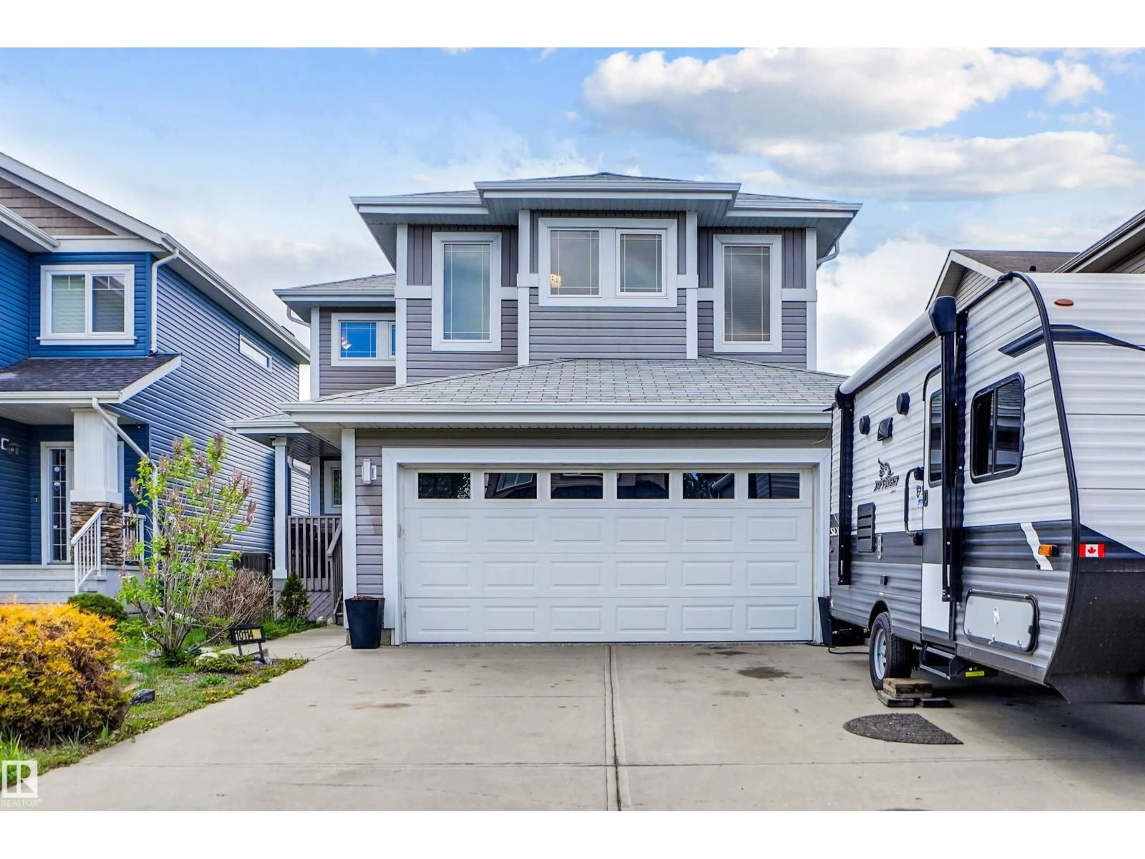 Home with vinyl exterior material, street for 10114 93 MORINVILLE ST, Morinville Alberta T8R0C4