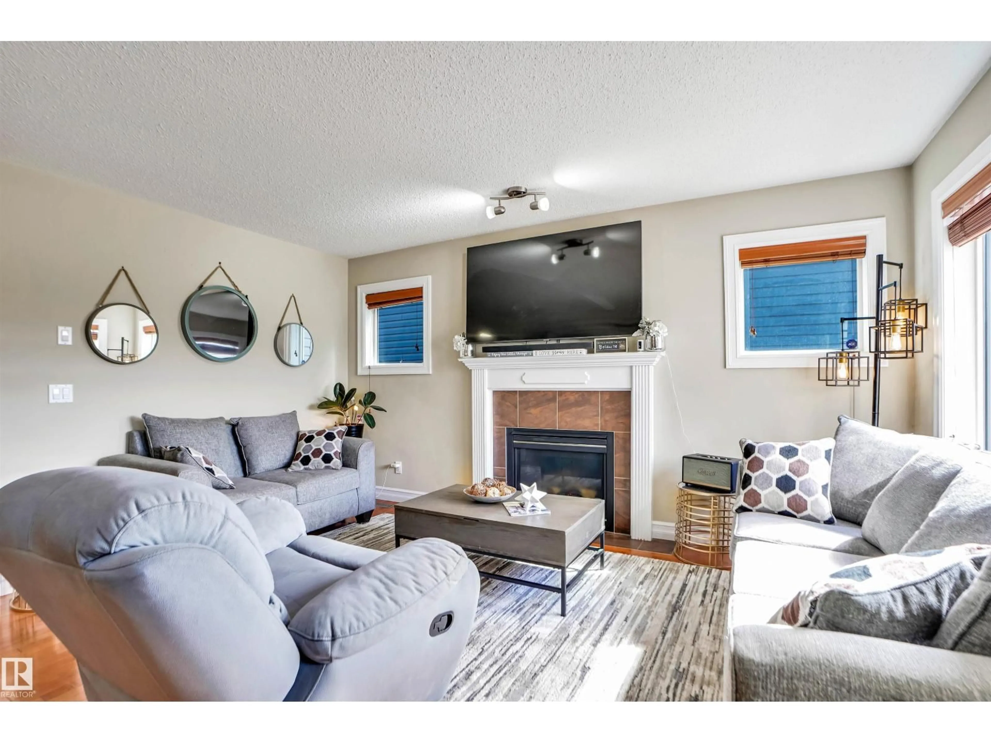 Living room with furniture, wood/laminate floor for 10114 93 MORINVILLE ST, Morinville Alberta T8R0C4