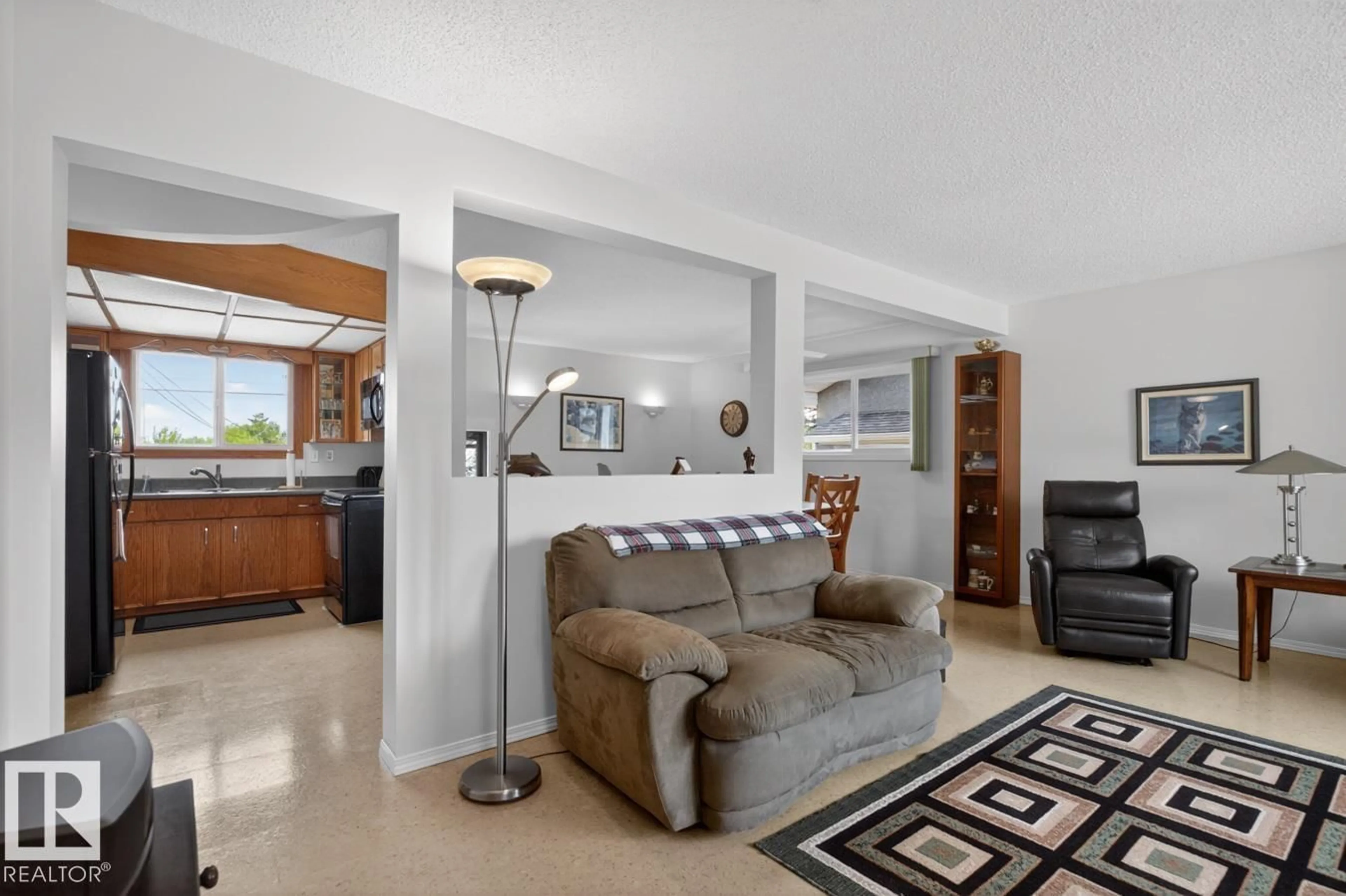 Living room with furniture, ceramic/tile floor for 9523 52 ST, Edmonton Alberta T6B1G8