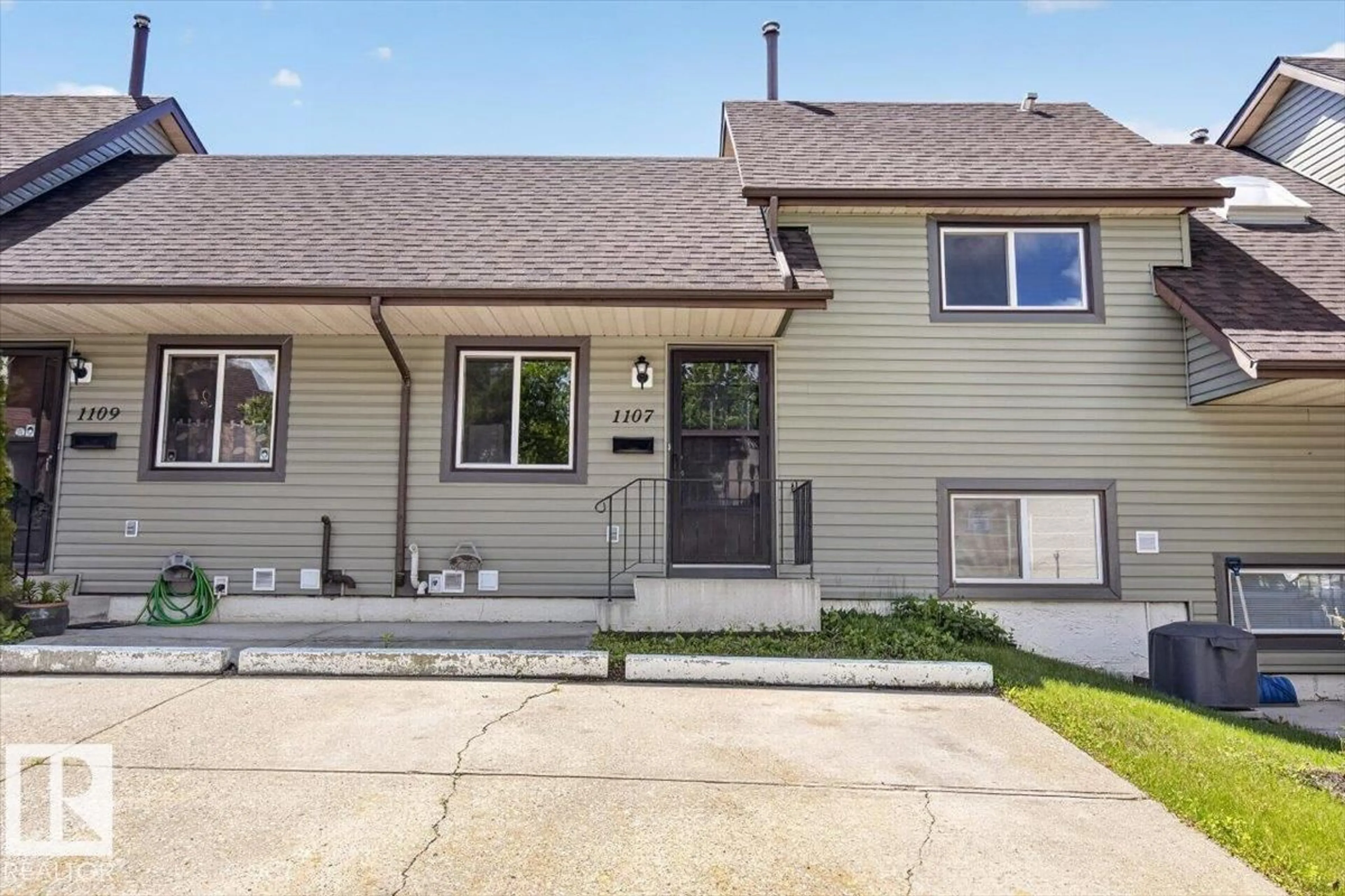 Home with vinyl exterior material, street for 1107 62 ST, Edmonton Alberta T6L2H7