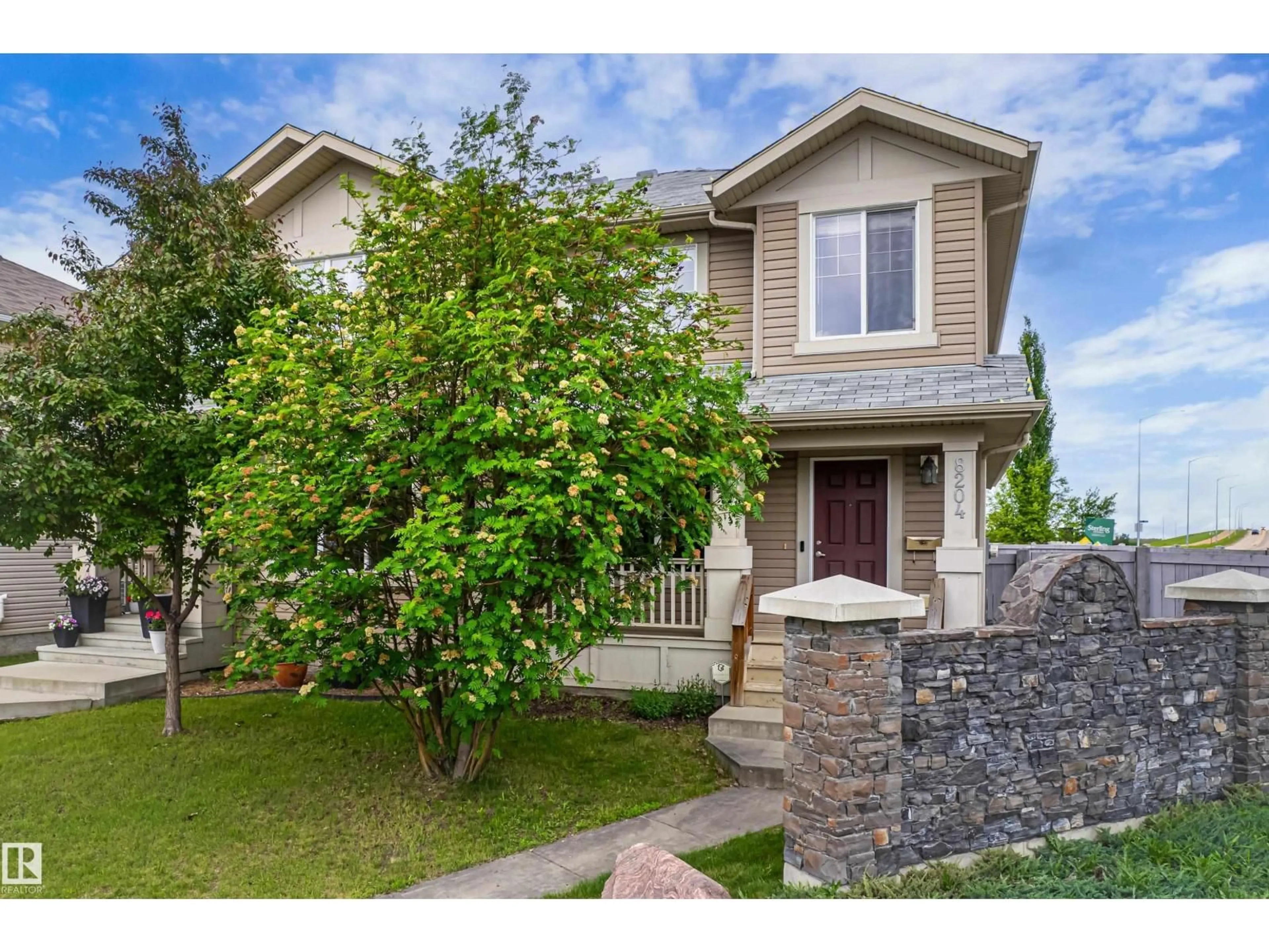 Home with vinyl exterior material, street for 8204 180 AV, Edmonton Alberta T5Z0H8