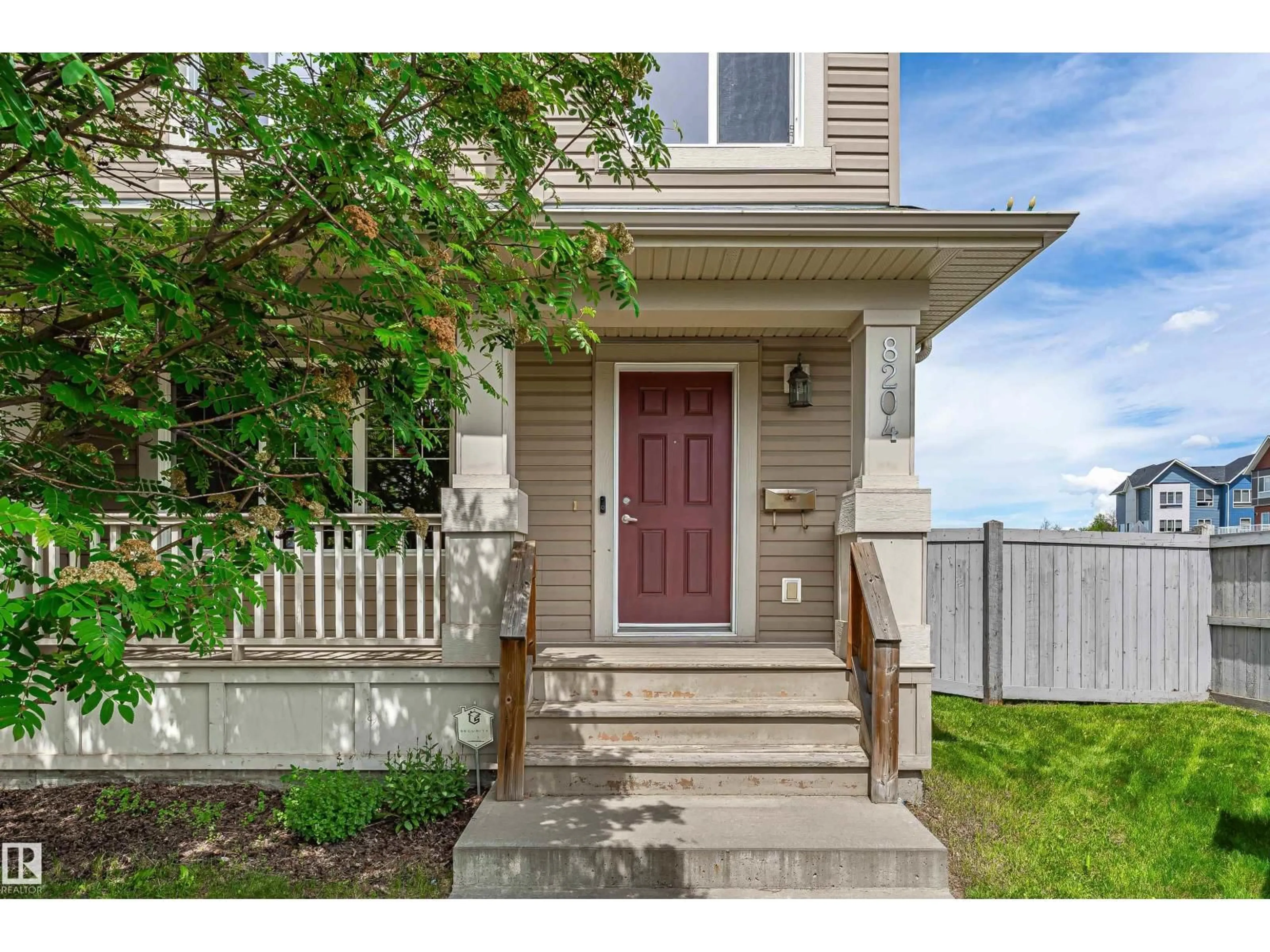 Home with vinyl exterior material, street for 8204 180 AV, Edmonton Alberta T5Z0H8