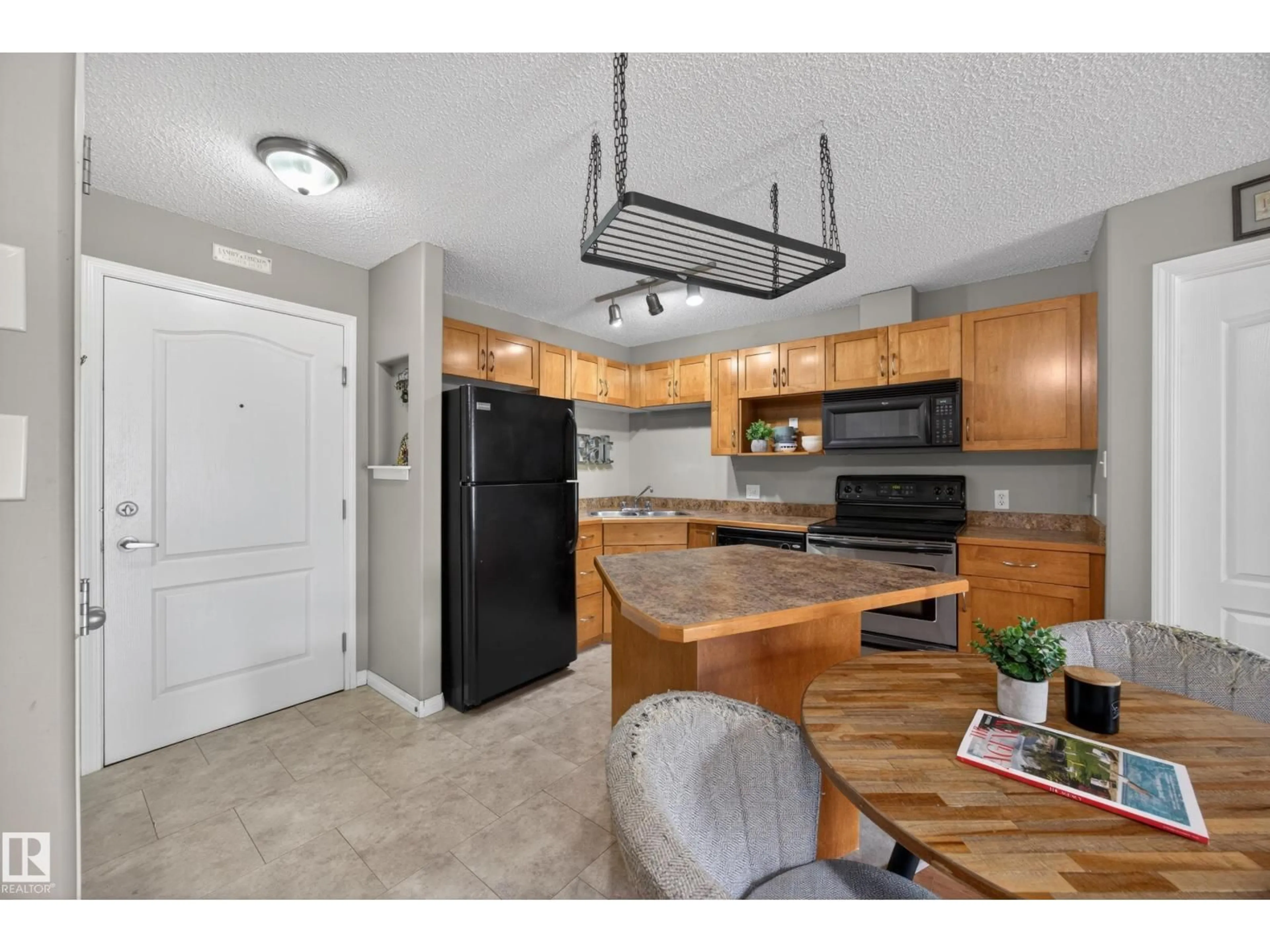 Open concept kitchen, unknown for 111 - 3425 19 NW, Edmonton Alberta T6T2B5
