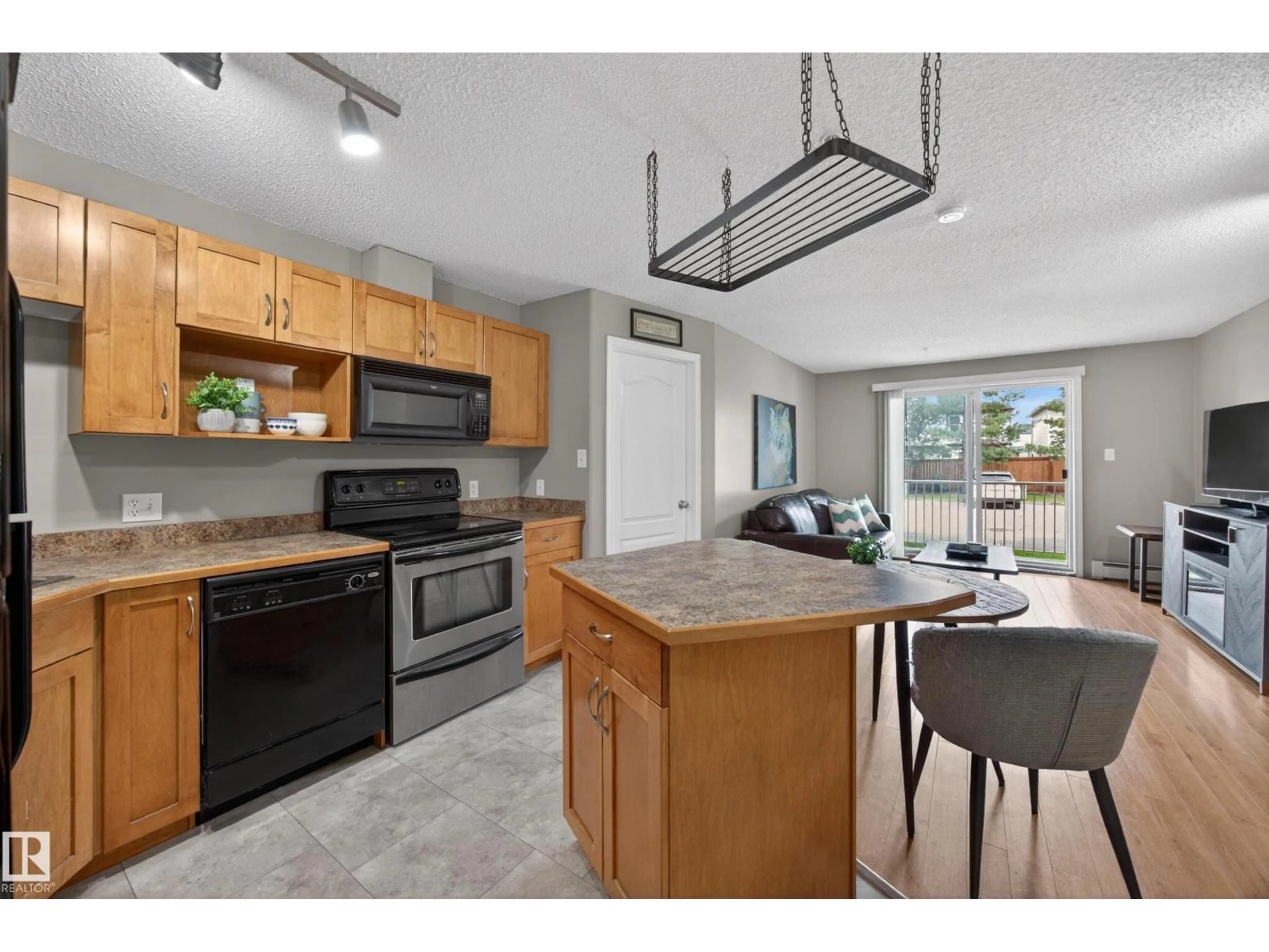Open concept kitchen, ceramic/tile floor for 111 - 3425 19 NW, Edmonton Alberta T6T2B5
