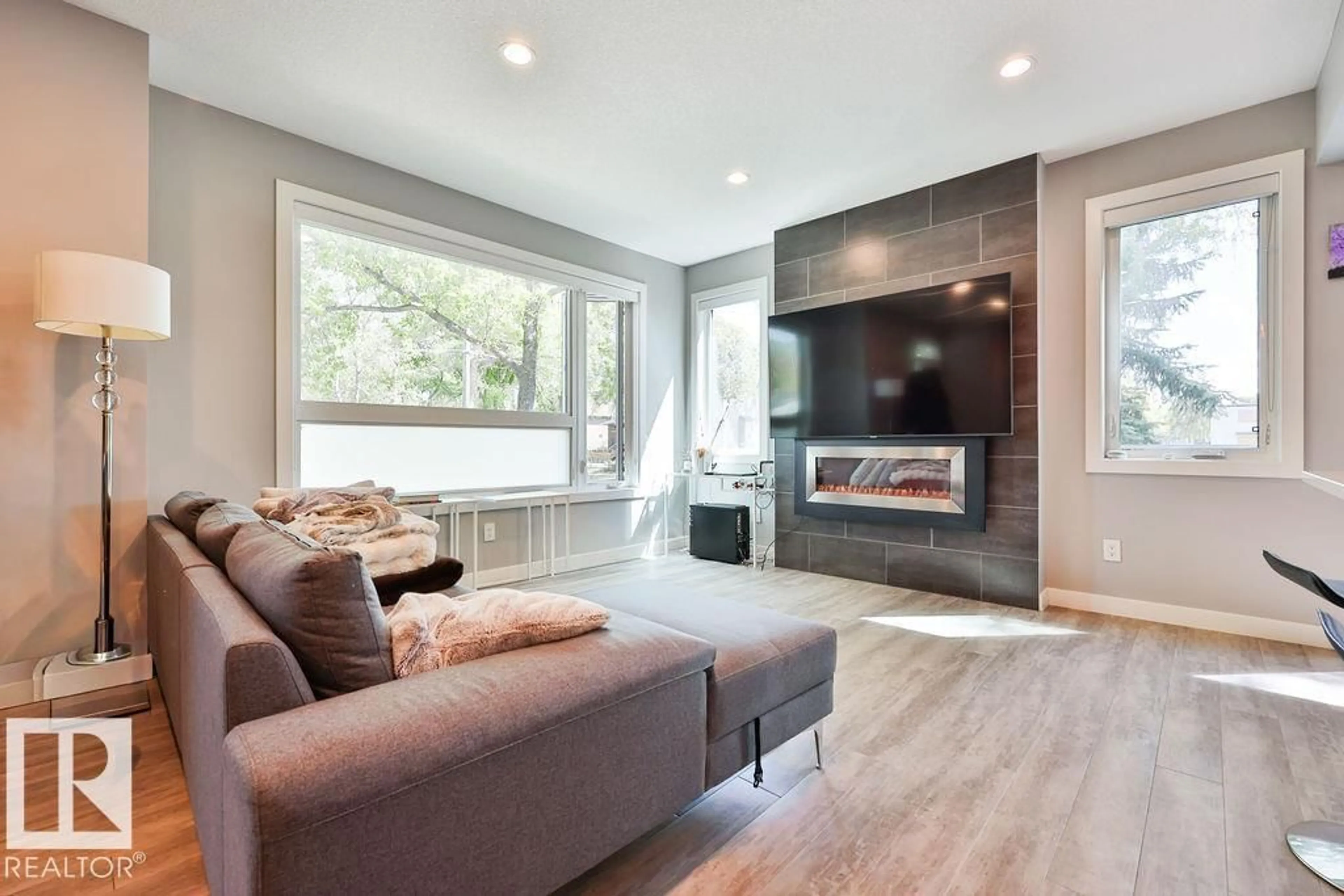 Living room with furniture, wood/laminate floor for 7202 98 ST, Edmonton Alberta T6E0Z1