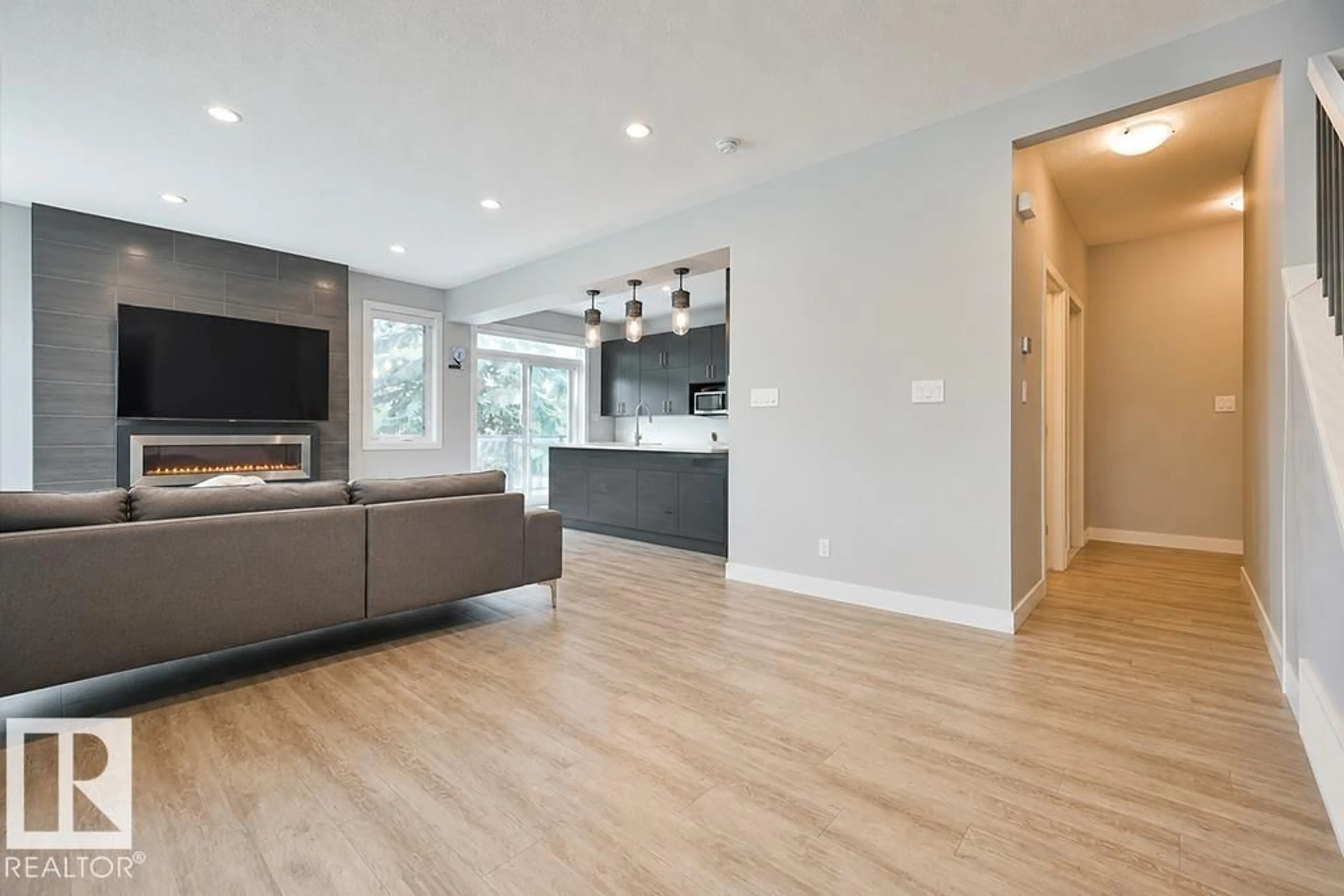 Open concept kitchen, wood/laminate floor for NW - 7202/7204 98 ST, Edmonton Alberta T6E0Z1