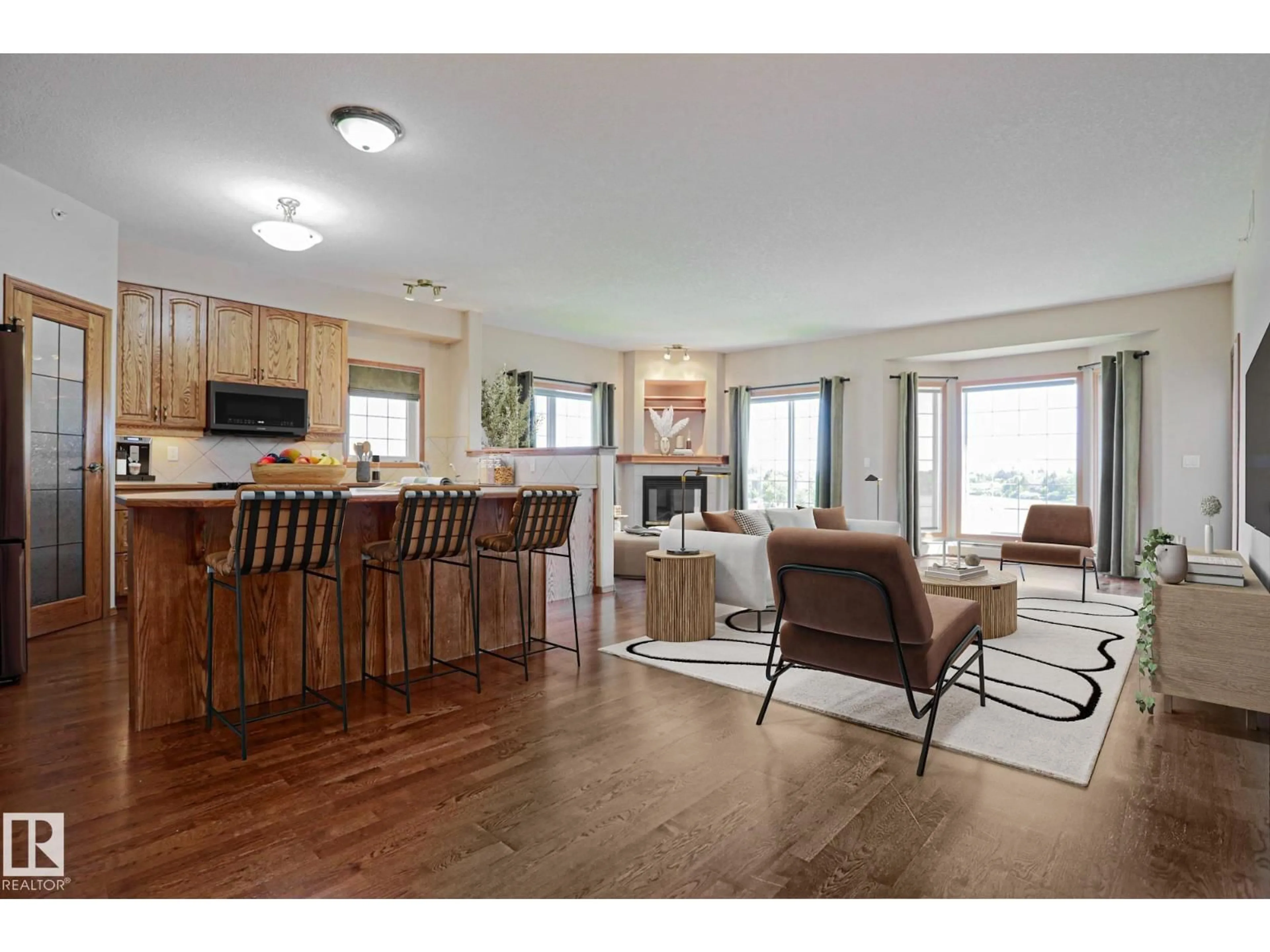 Open concept kitchen, wood/laminate floor for #406 - 11260 153 AV, Edmonton Alberta T5X6E7