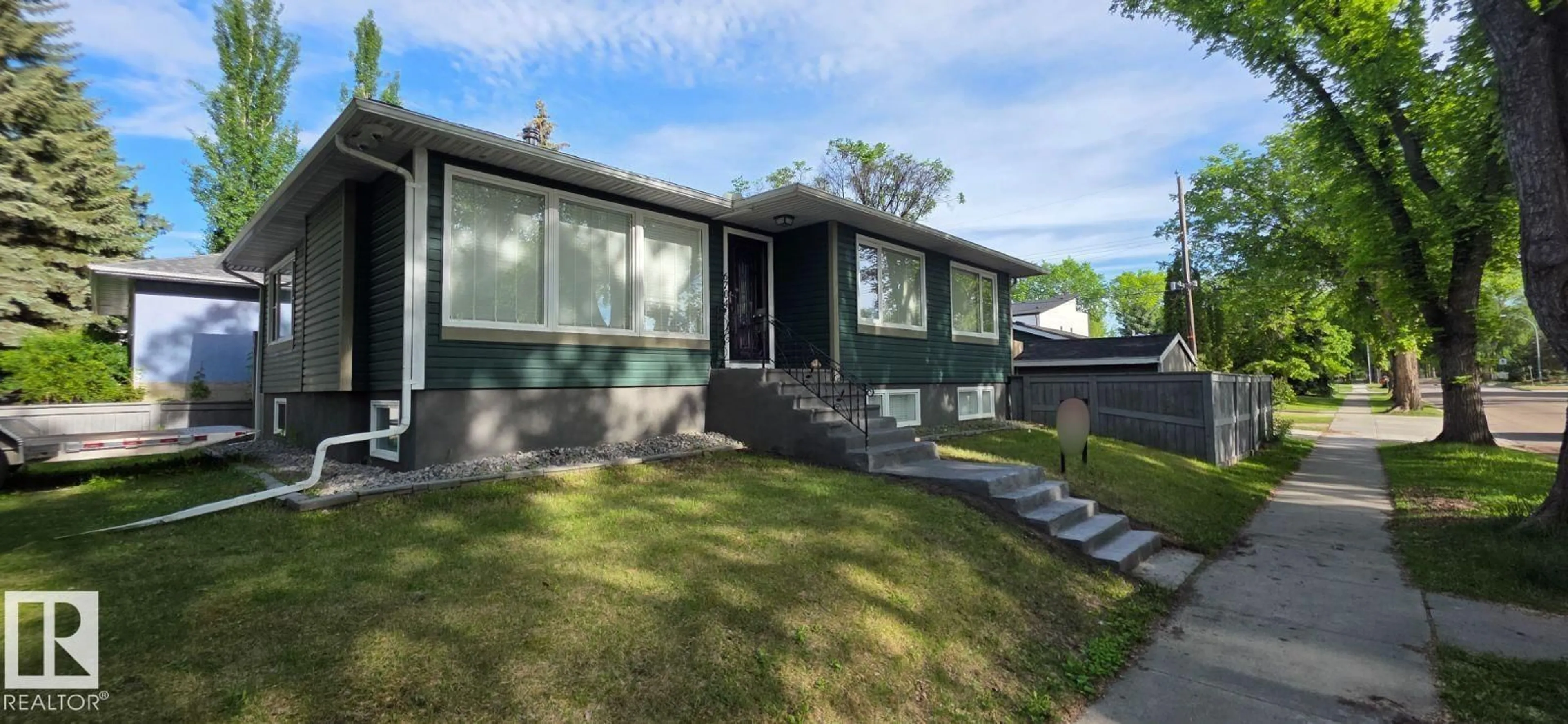 Home with vinyl exterior material, street for 6704 93 ST, Edmonton Alberta T6E3B4