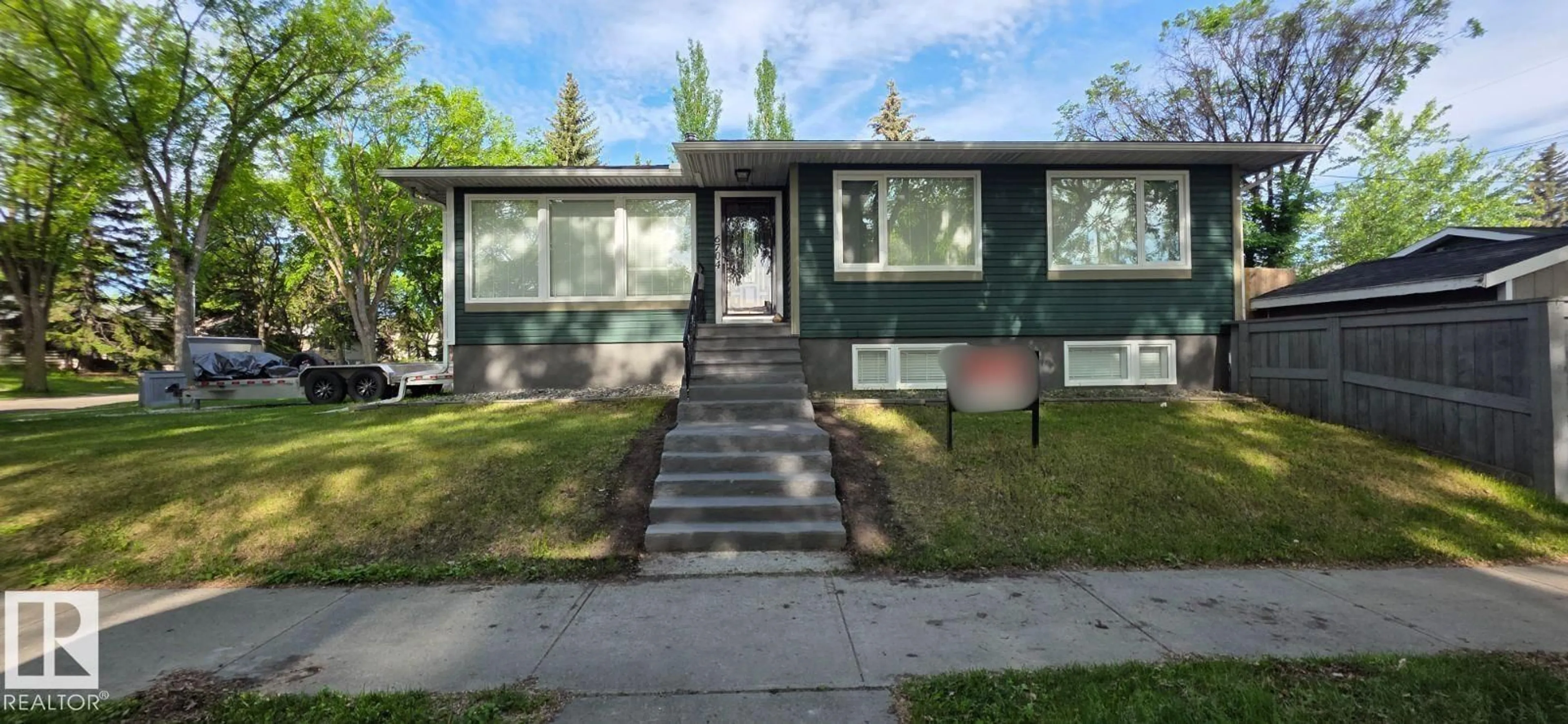 Home with vinyl exterior material, street for 6704 93 ST, Edmonton Alberta T6E3B4