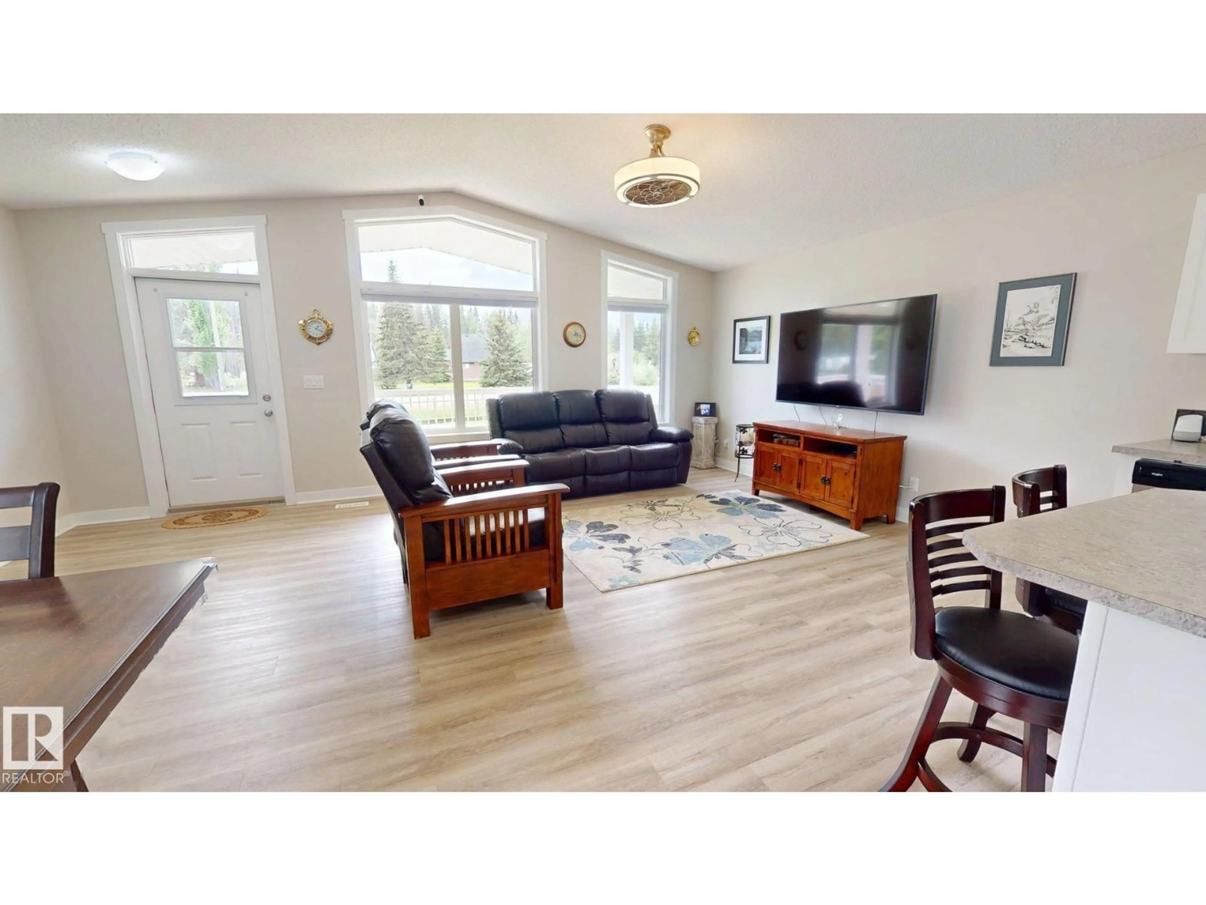 Living room with furniture, wood/laminate floor for 211 LABONTE DR, Rural Athabasca County Alberta T0A0M0