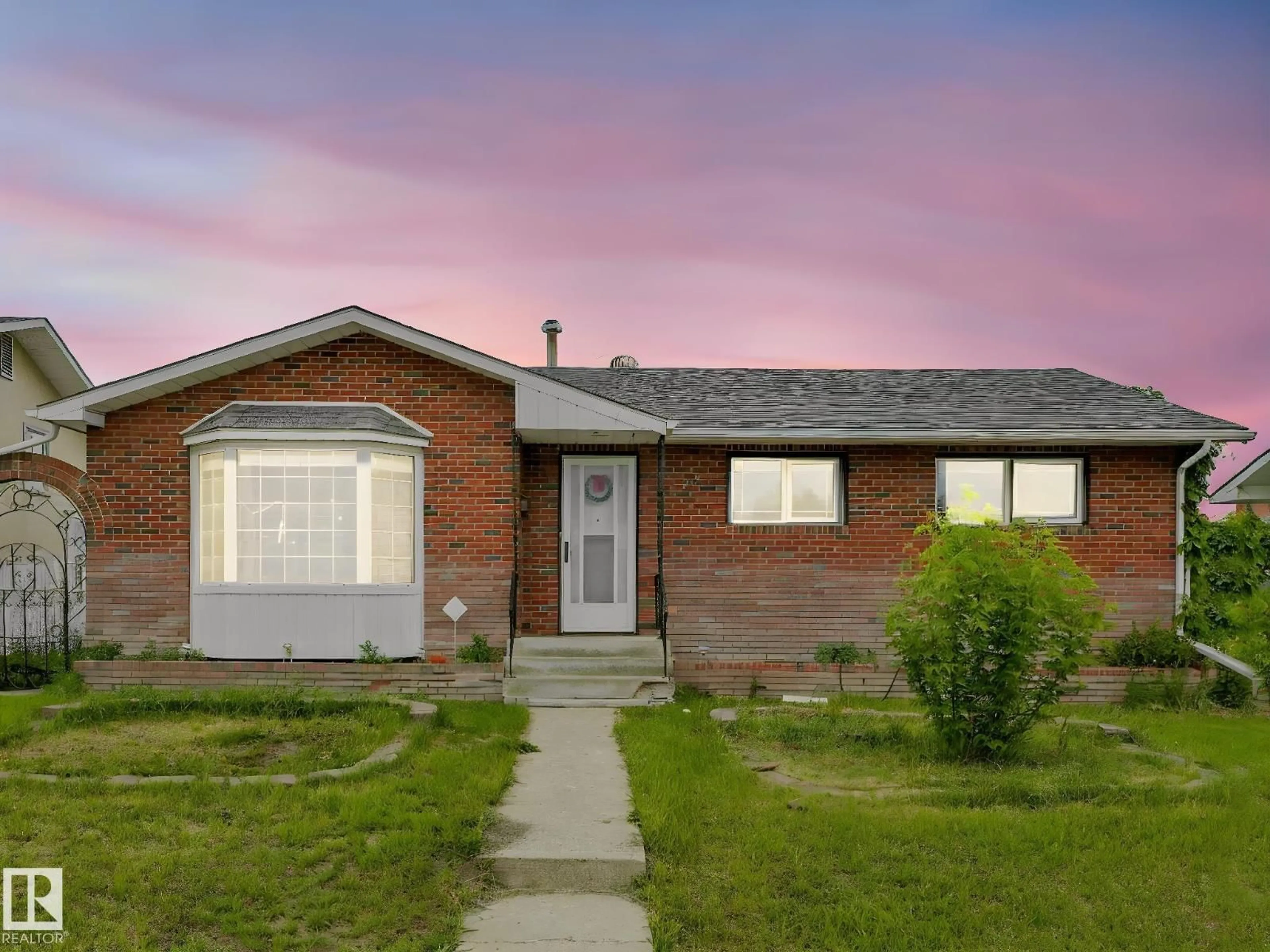 Home with brick exterior material, street for 9528 151 AV, Edmonton Alberta T5E2R3