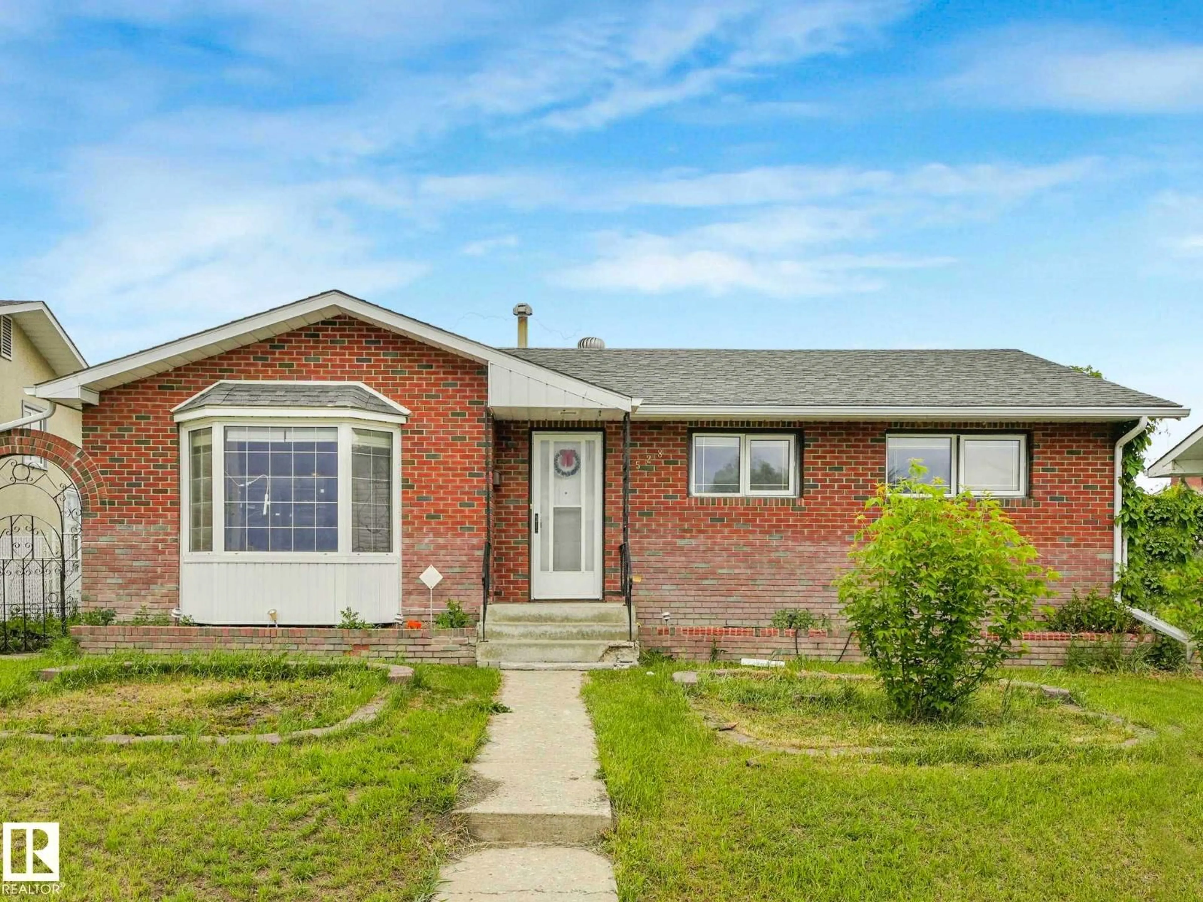 Home with brick exterior material, street for 9528 151 AV, Edmonton Alberta T5E2R3