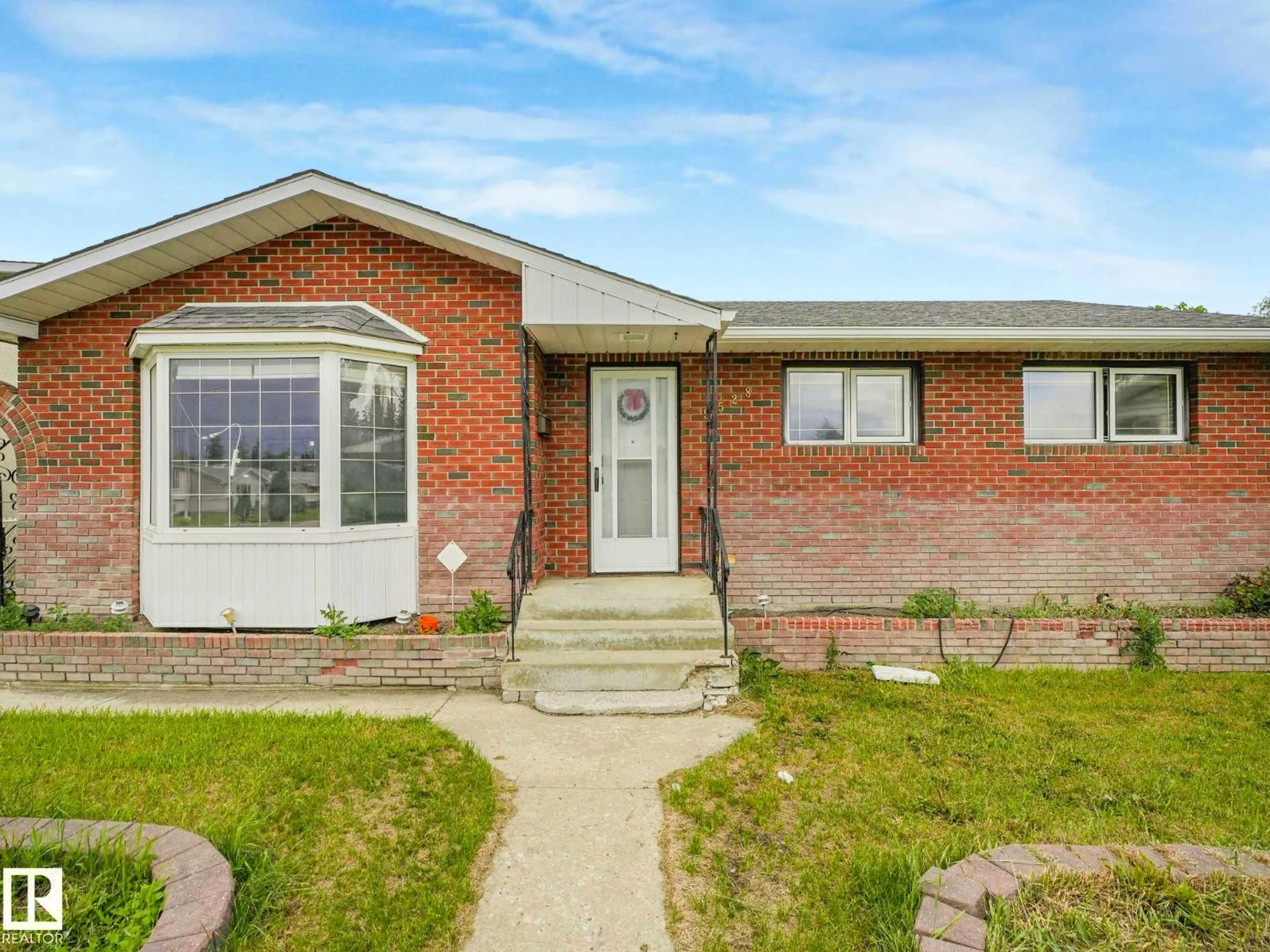 Home with brick exterior material, street for 9528 151 AV, Edmonton Alberta T5E2R3