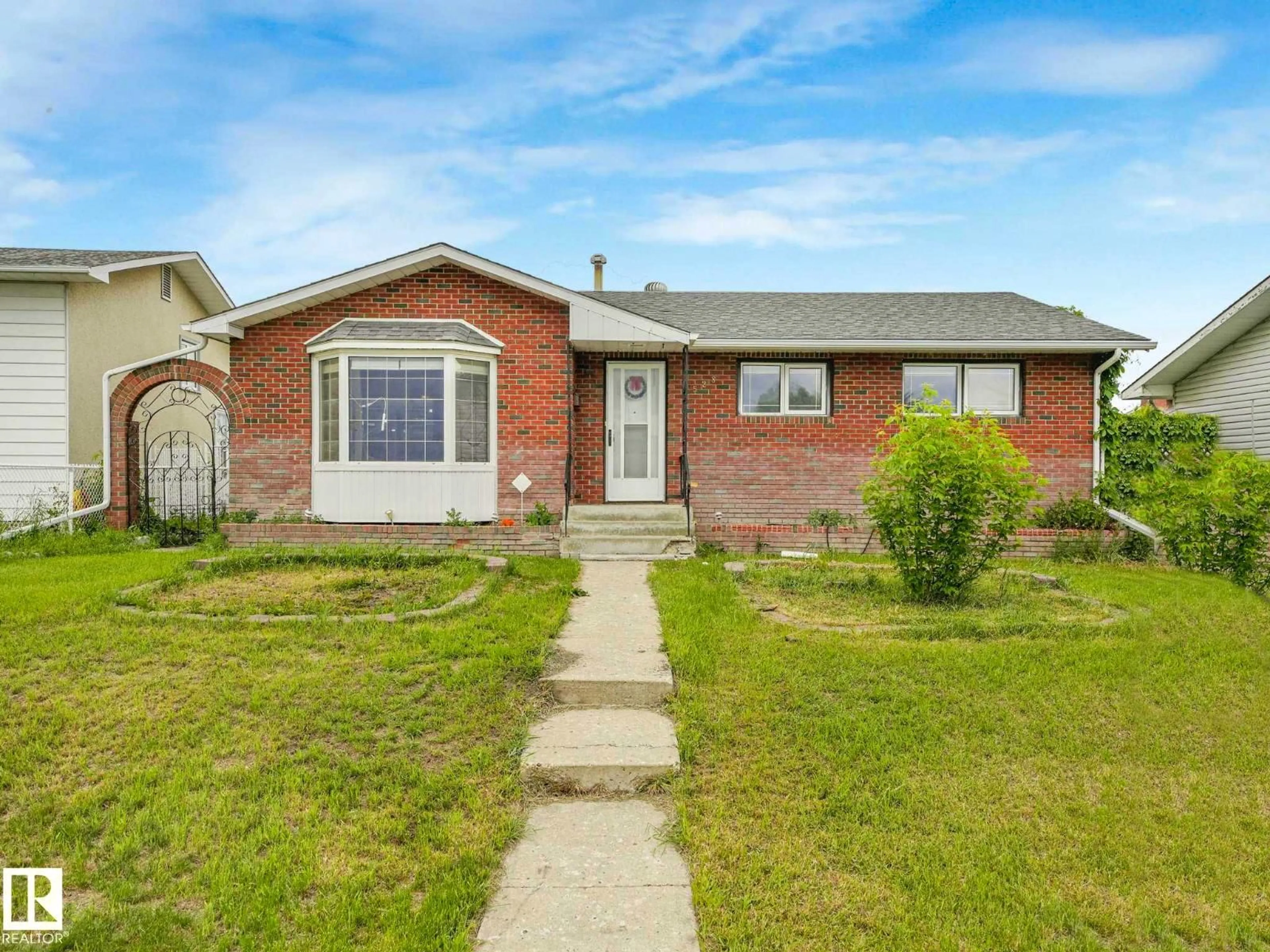 Home with brick exterior material, street for 9528 151 AV, Edmonton Alberta T5E2R3