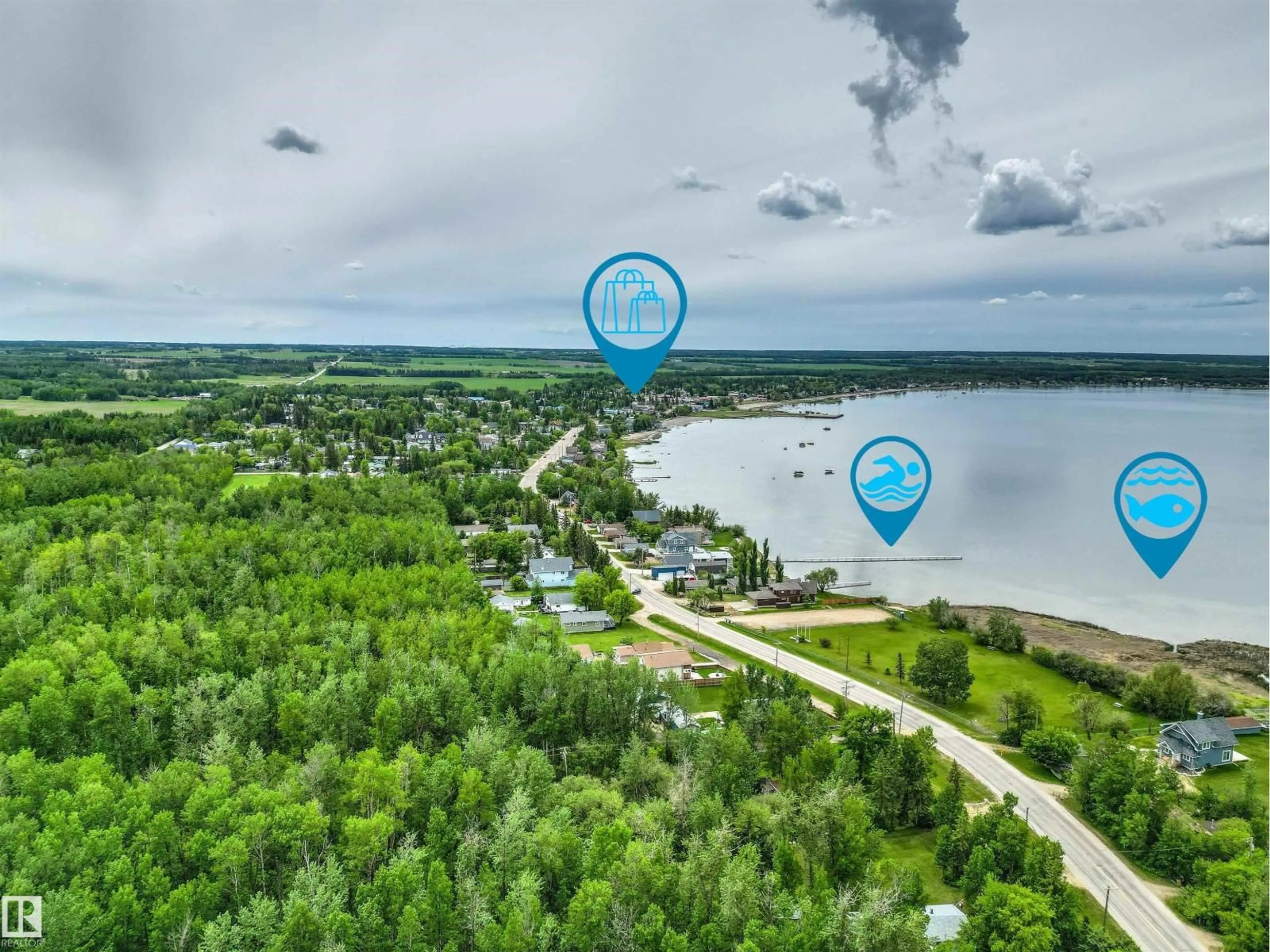A pic from outside/outdoor area/front of a property/back of a property/a pic from drone, water/lake/river/ocean view for 4820 48A AV, Rural Lac Ste. Anne County Alberta T0E0A0