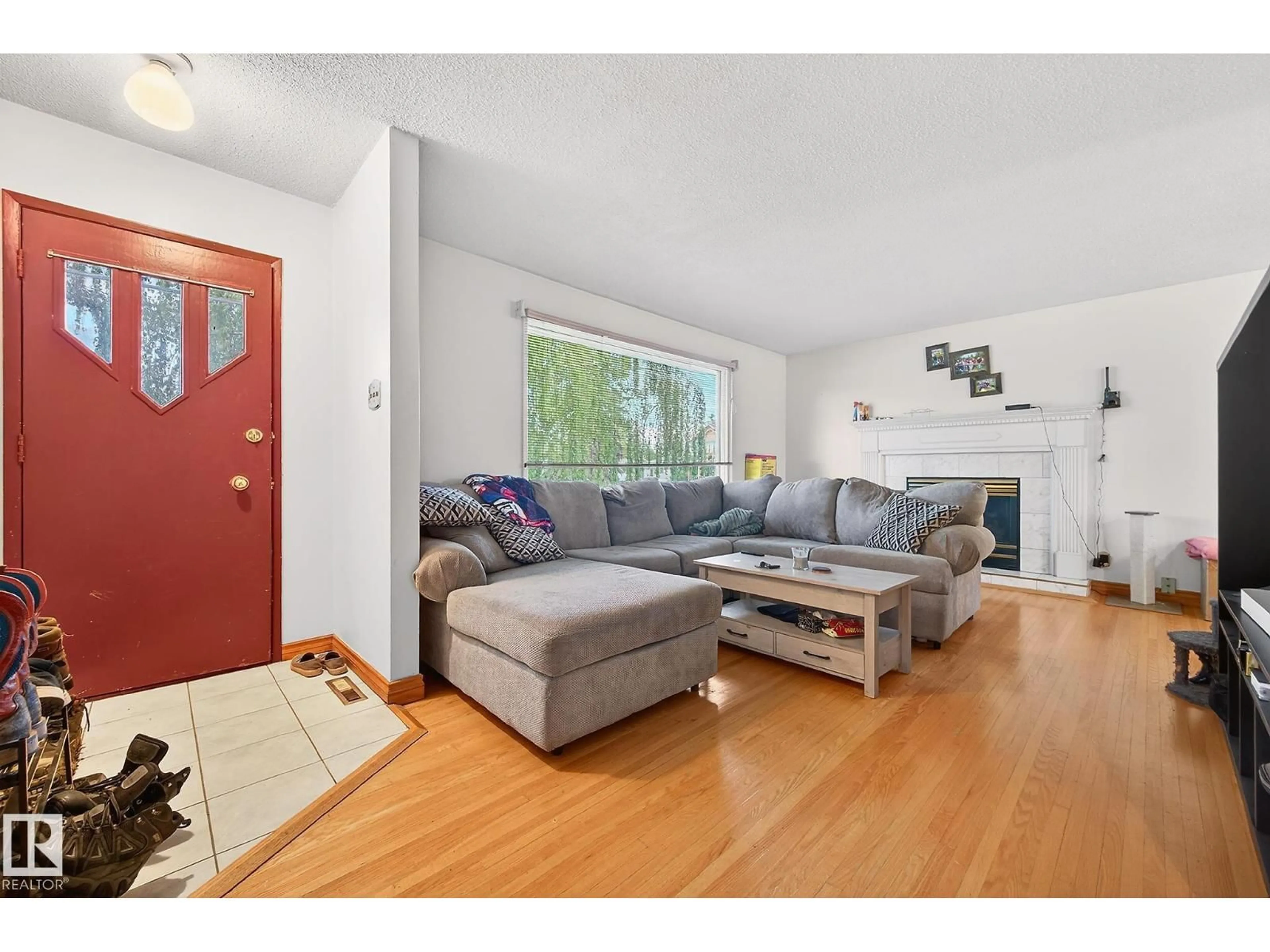 Living room with furniture, wood/laminate floor for NW - 8814 162 ST, Edmonton Alberta T5R2M4