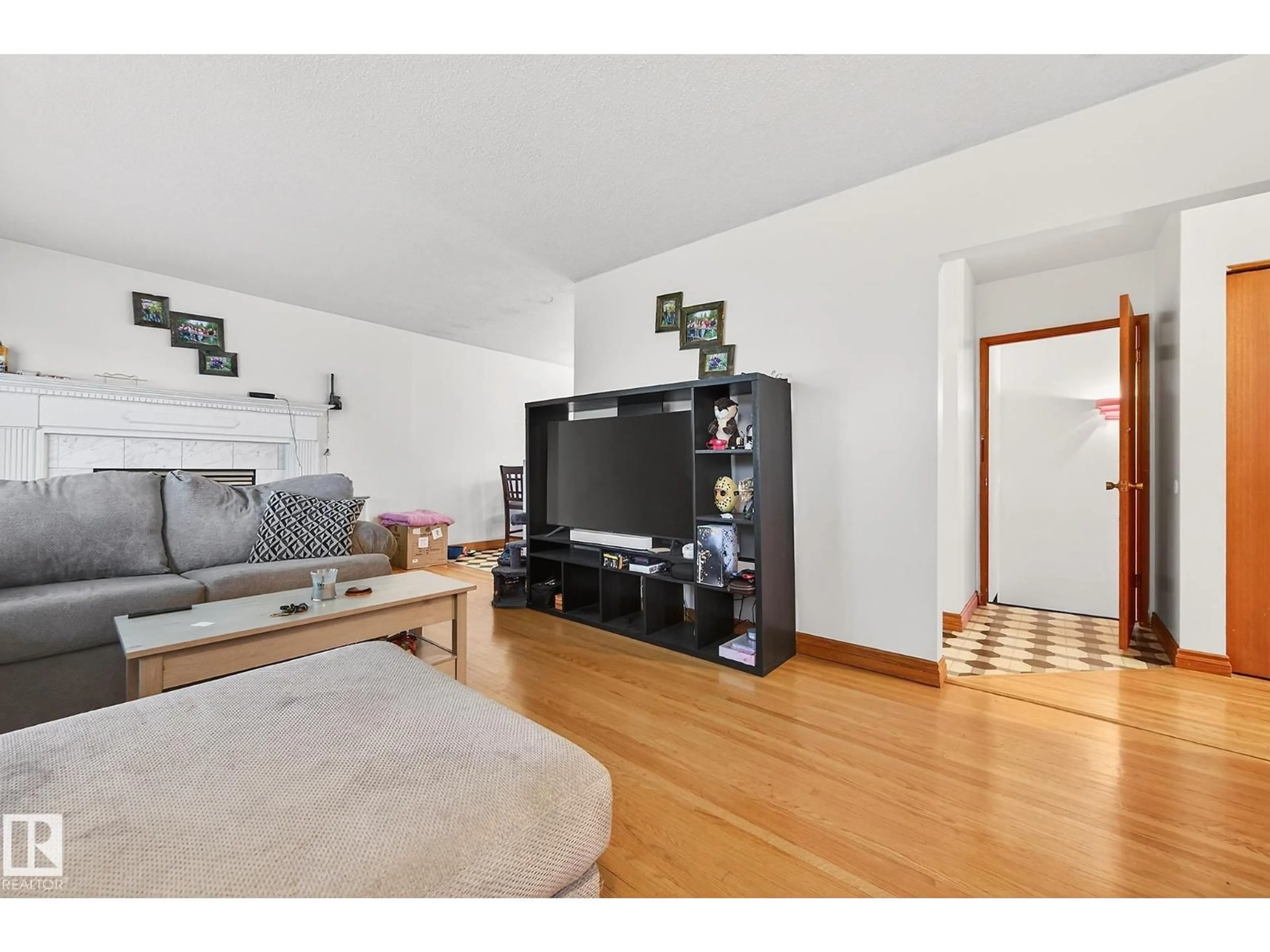 Living room with furniture, wood/laminate floor for NW - 8814 162 ST, Edmonton Alberta T5R2M4