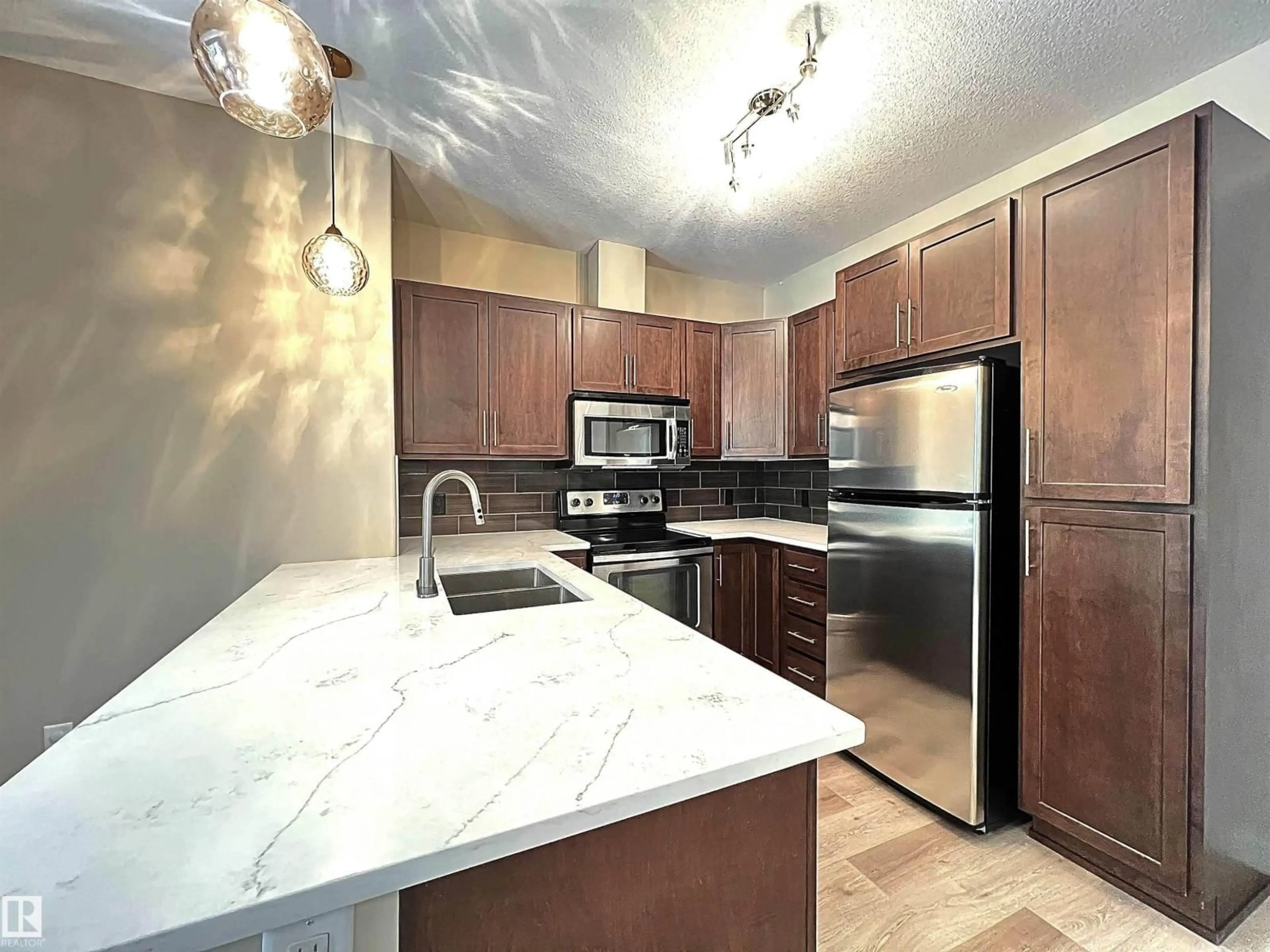 Open concept kitchen, unknown for 308 - 140 AMBLESIDE LINK LI, Edmonton Alberta T6W0V3