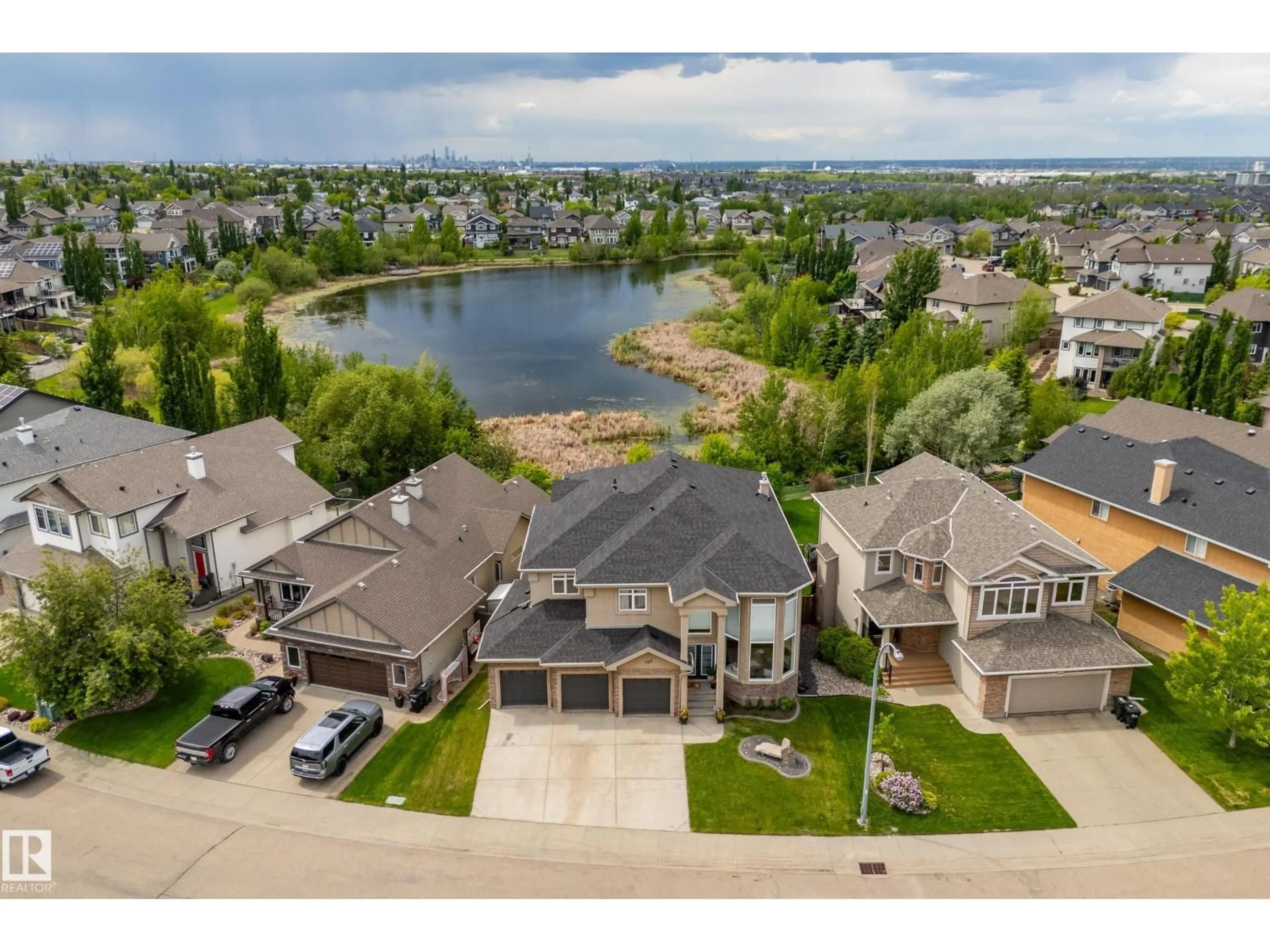 A pic from outside/outdoor area/front of a property/back of a property/a pic from drone, water/lake/river/ocean view for 358 COWAN CR, Sherwood Park Alberta T8H0E5