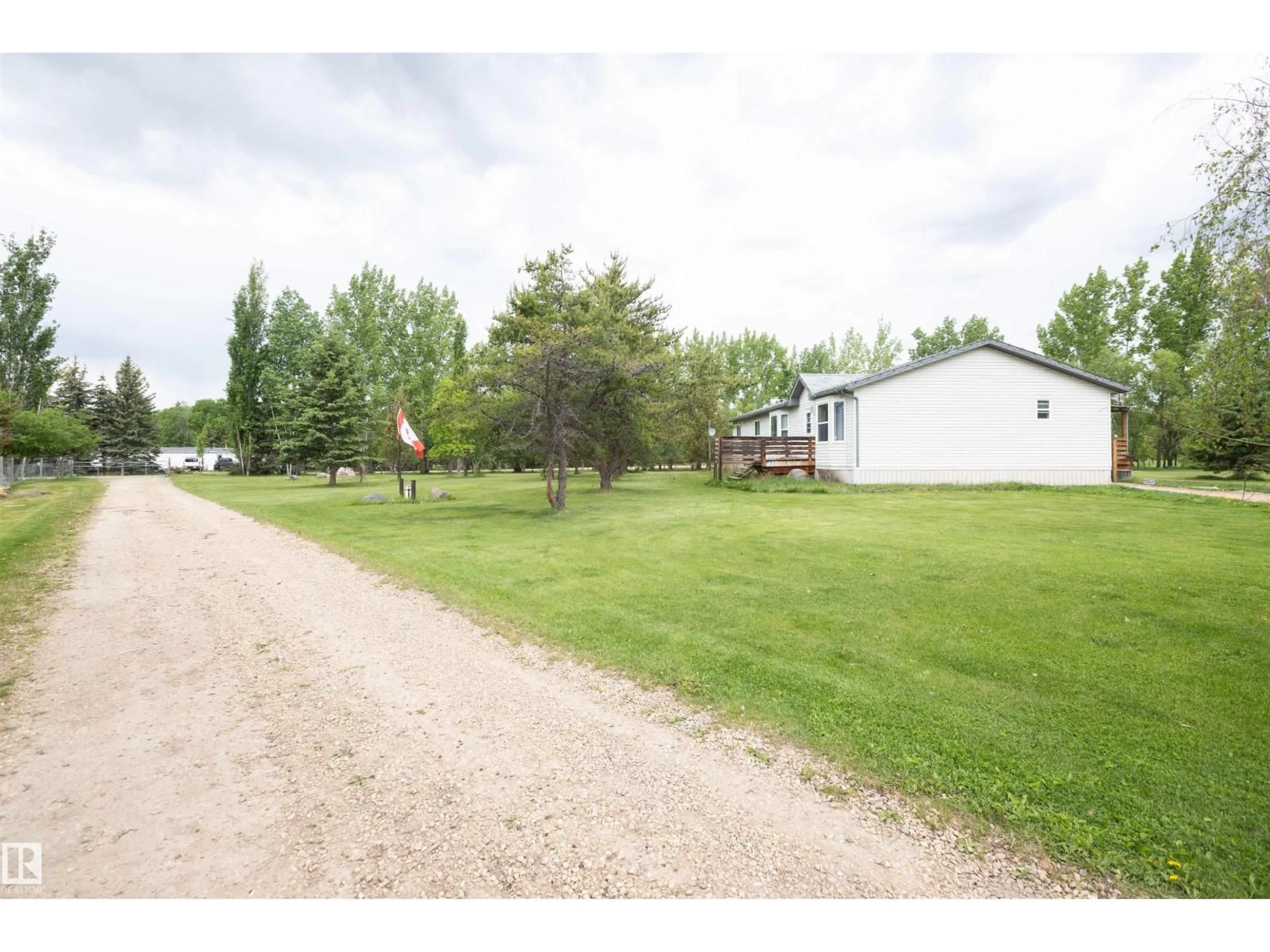 A pic from outside/outdoor area/front of a property/back of a property/a pic from drone, unknown for 209 - 5128 18 HI, Rural Barrhead County Alberta T7N1N3