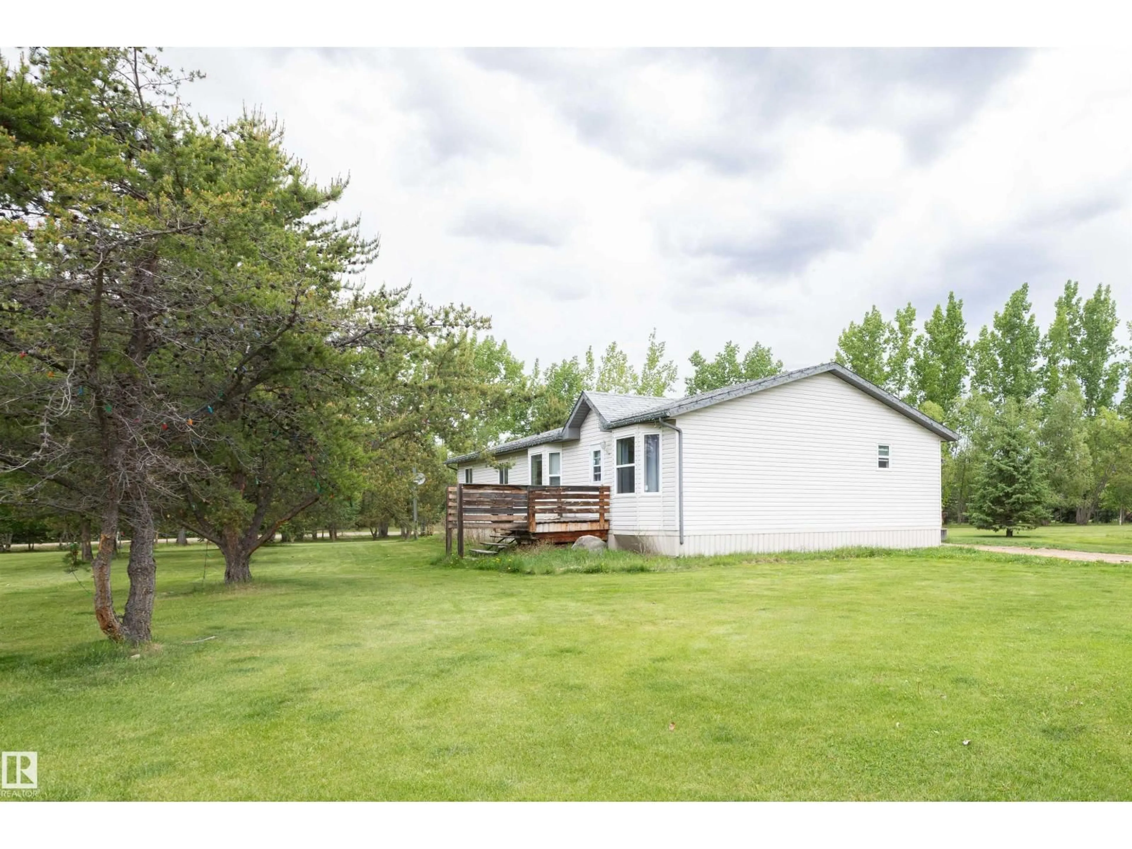 A pic from outside/outdoor area/front of a property/back of a property/a pic from drone, water/lake/river/ocean view for 209 - 5128 18 HI, Rural Barrhead County Alberta T7N1N3