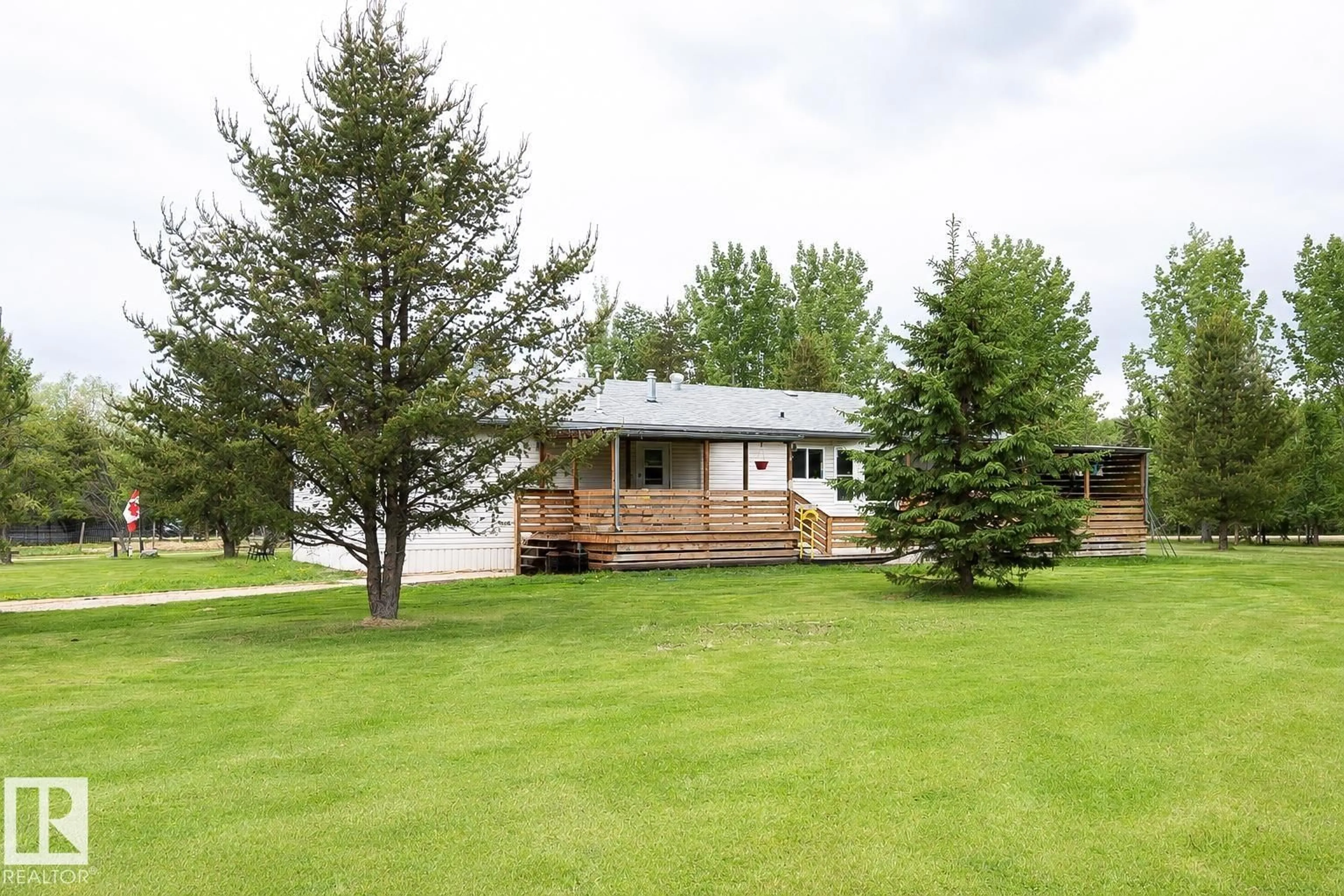 A pic from outside/outdoor area/front of a property/back of a property/a pic from drone, water/lake/river/ocean view for 209 - 5128 18 HI, Rural Barrhead County Alberta T7N1N3