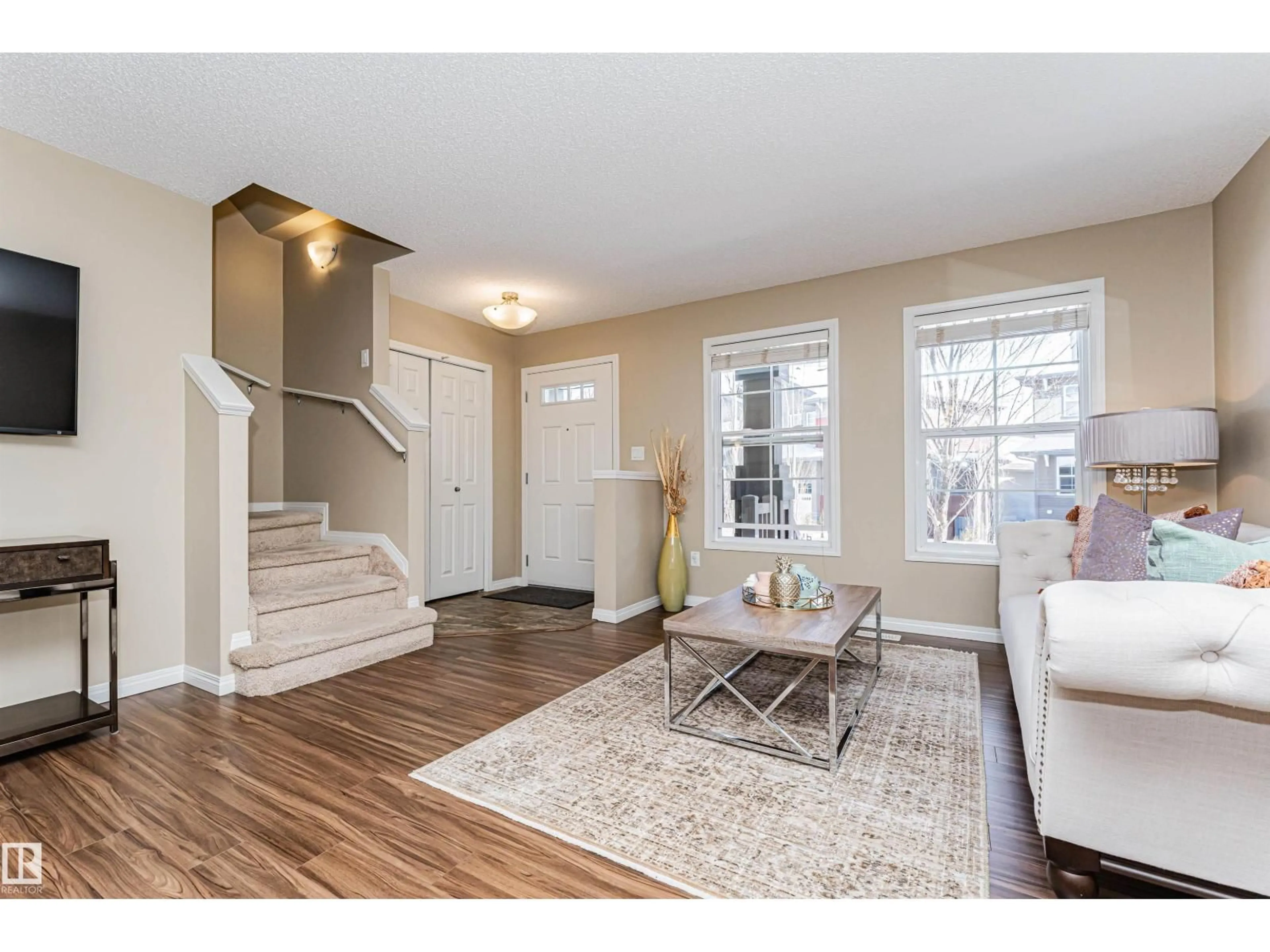 Living room with furniture, wood/laminate floor for #31 - 4029 ORCHARDS DR, Edmonton Alberta T6X1V2