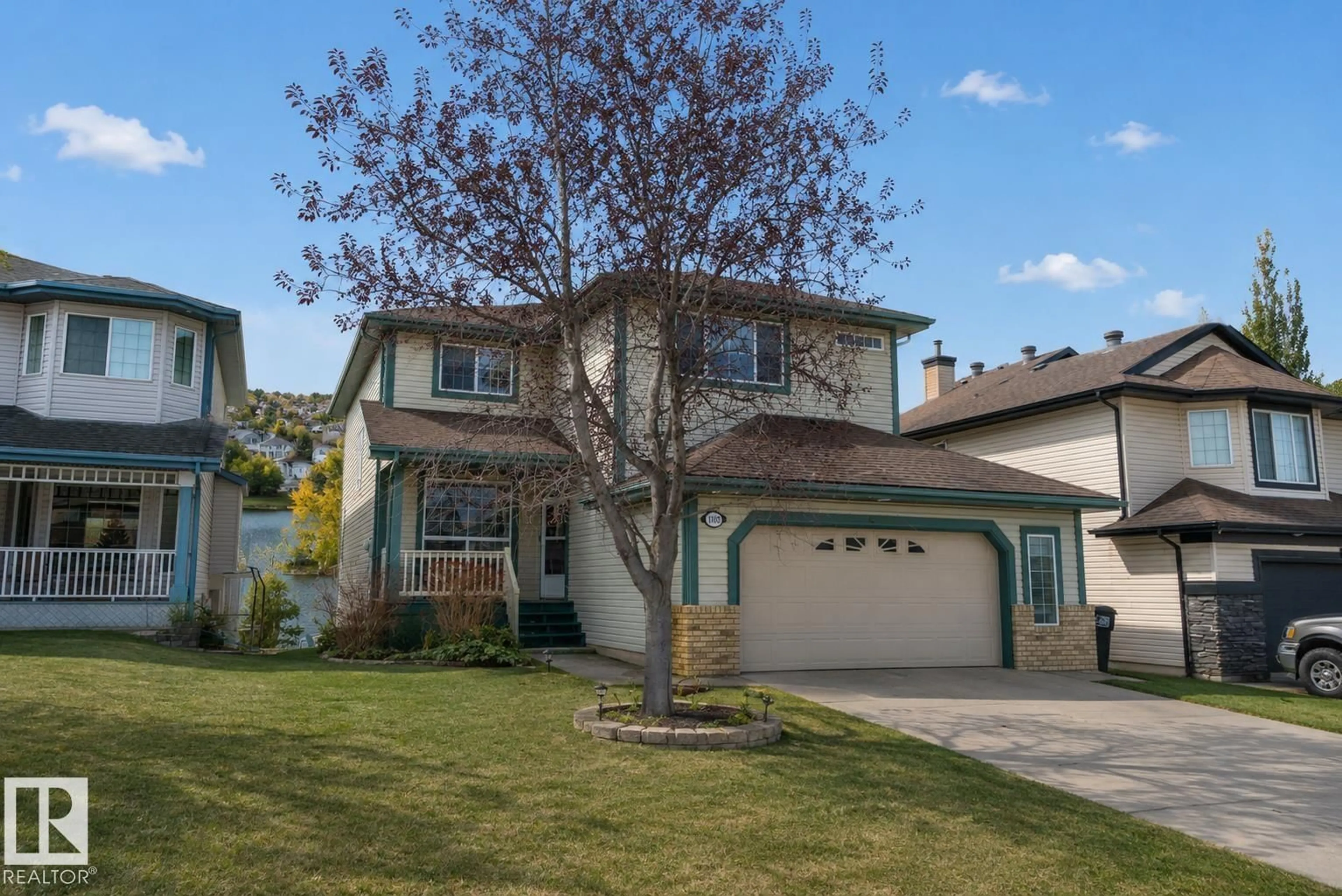 Home with vinyl exterior material, street for 1105 KLARVATTEN CV, Edmonton Alberta T5Z3N3