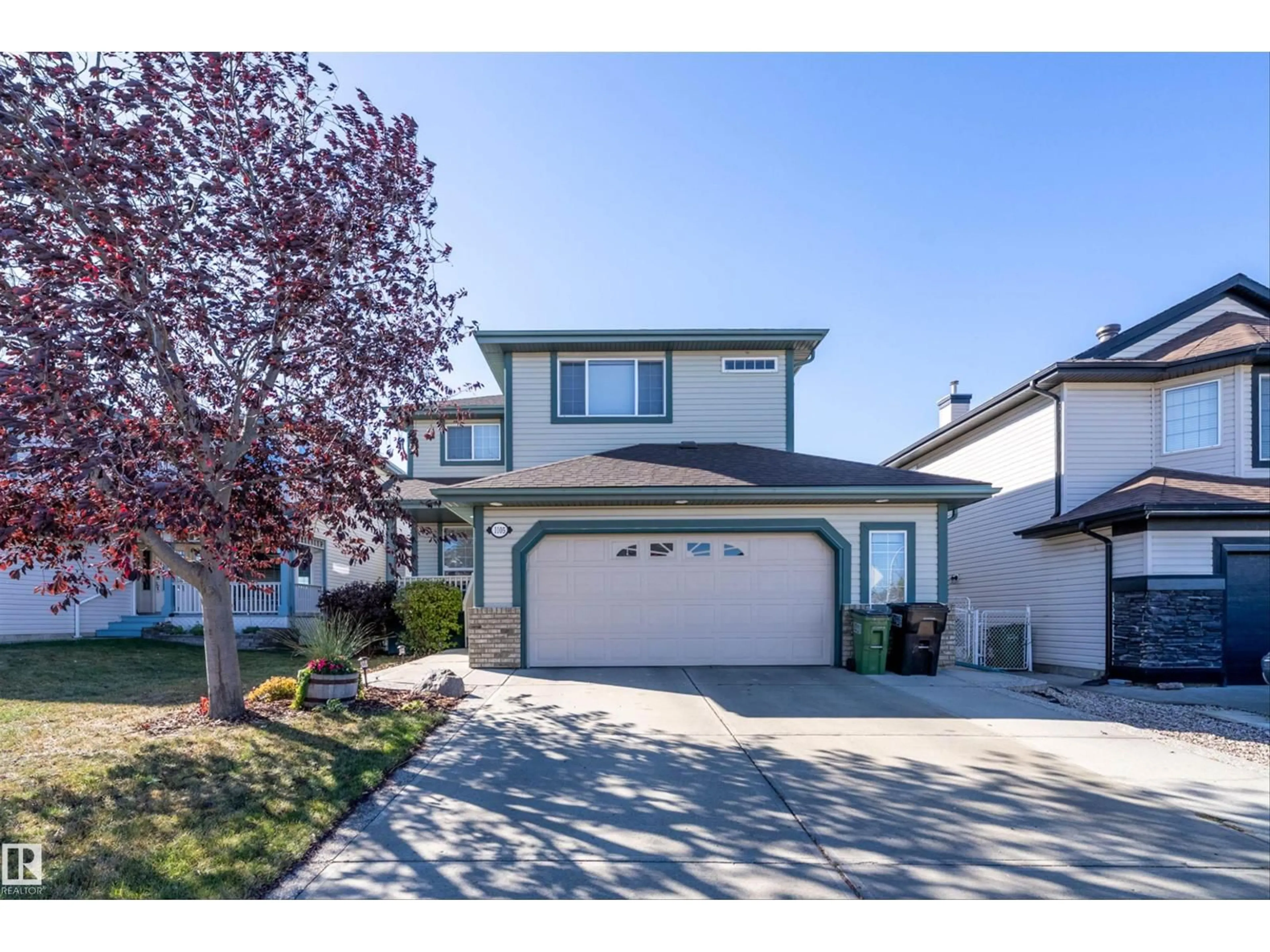 Home with vinyl exterior material, street for 1105 KLARVATTEN CV, Edmonton Alberta T5Z3N3