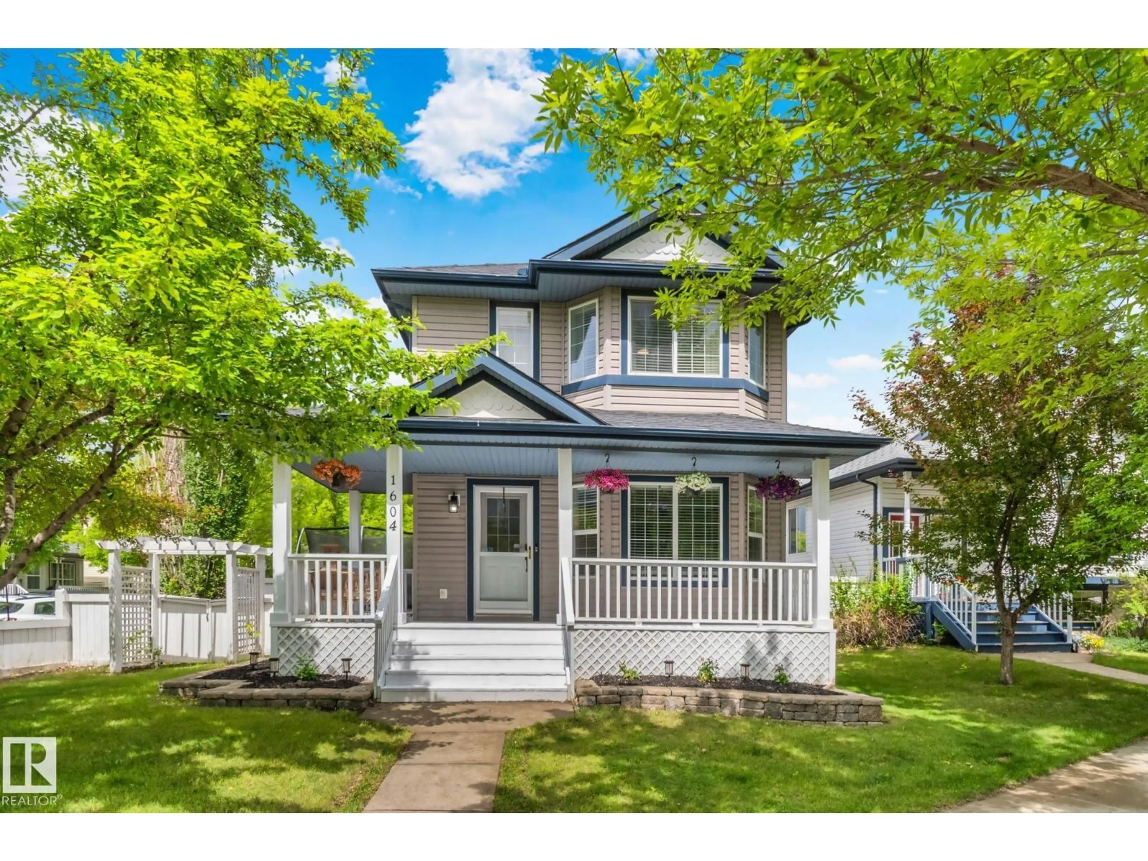 Home with vinyl exterior material, street for 1604 TOMPKINS PL, Edmonton Alberta T6R2Y5
