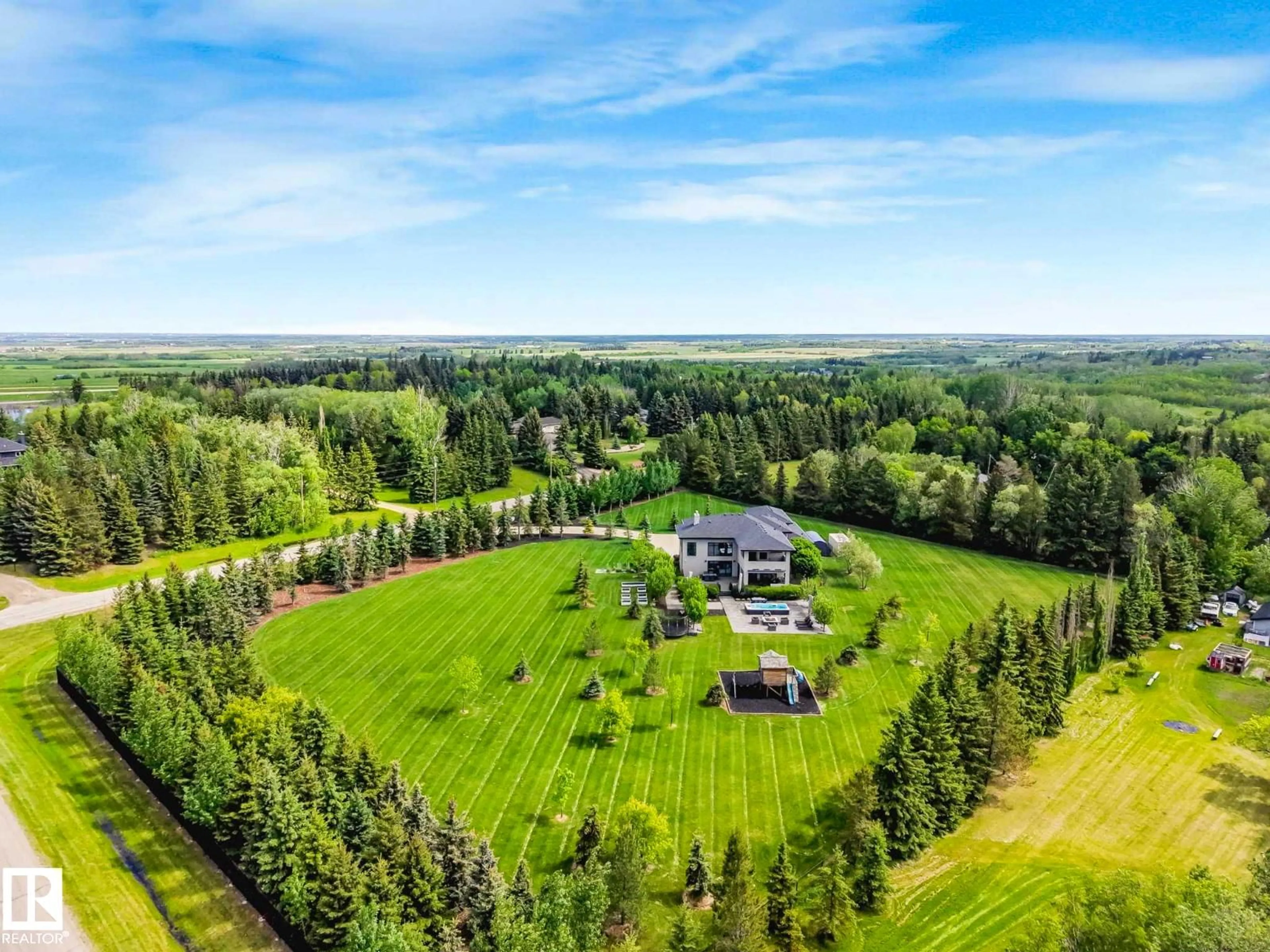 A pic from outside/outdoor area/front of a property/back of a property/a pic from drone, forest/trees view for #2 - 22555 TWP ROAD 530, Rural Strathcona County Alberta T8A4T7
