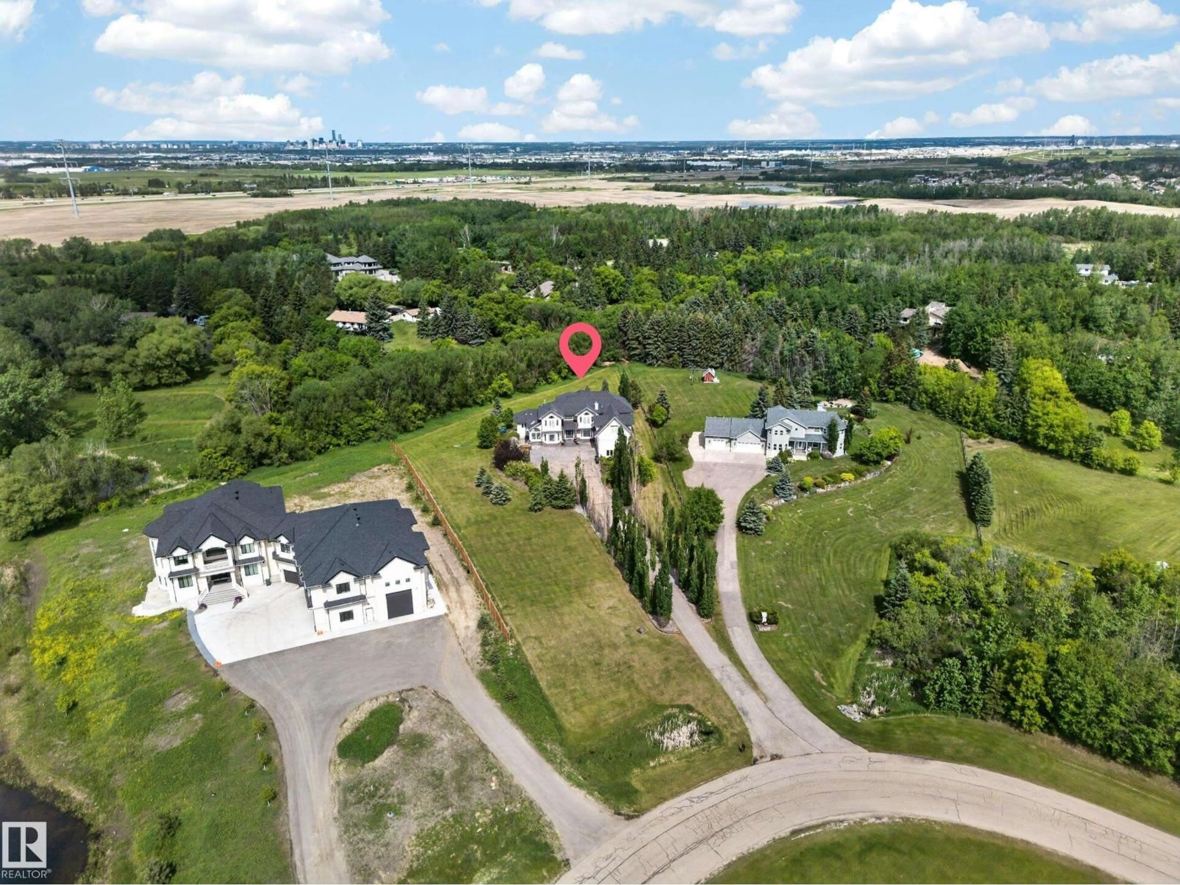 A pic from outside/outdoor area/front of a property/back of a property/a pic from drone, water/lake/river/ocean view for 50 52216 RGE ROAD 233, Rural Strathcona County Alberta T8B1C9