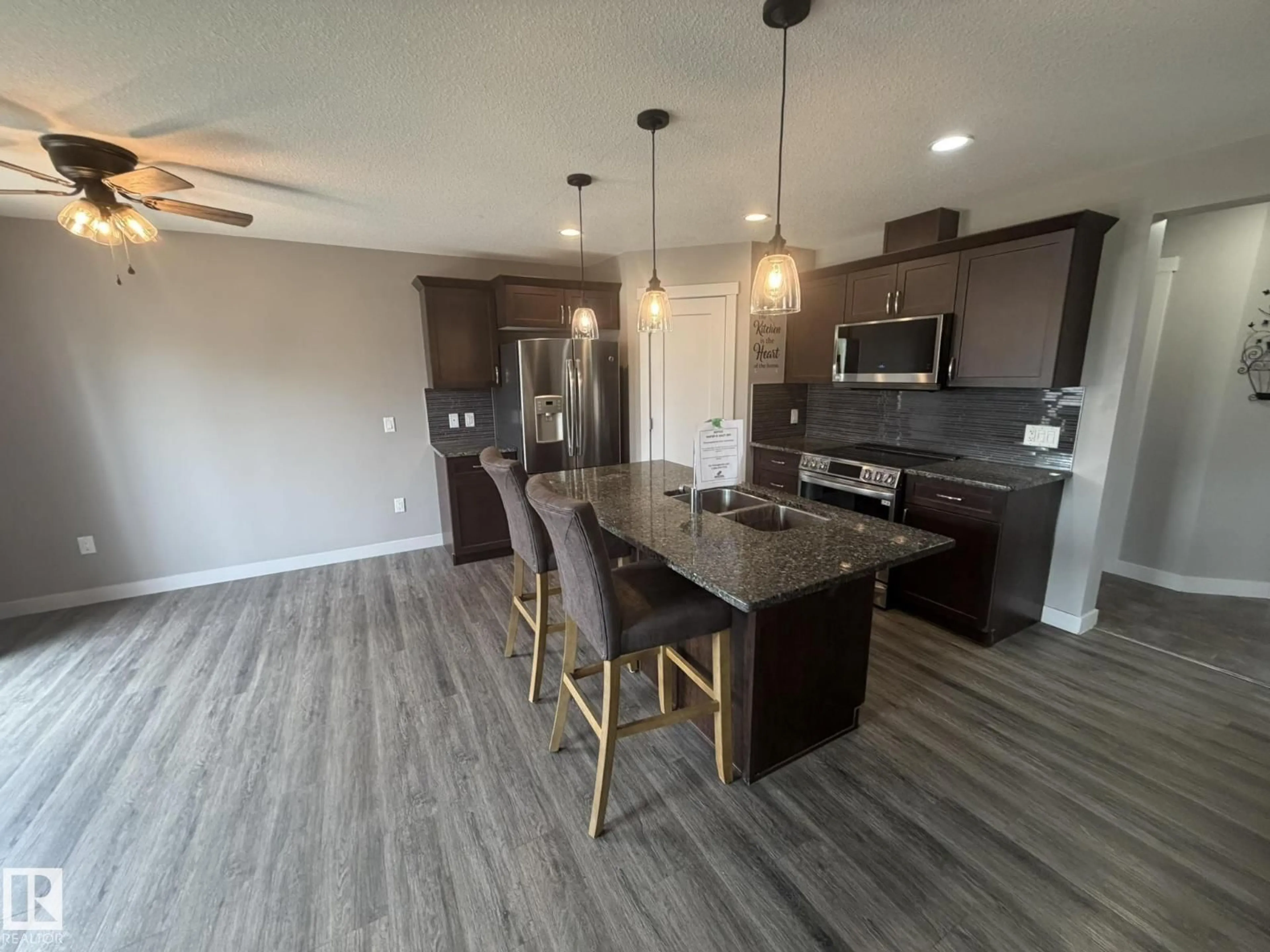 Open concept kitchen, unknown for 6821 EVANS WD NW, Edmonton Alberta T6M0T3