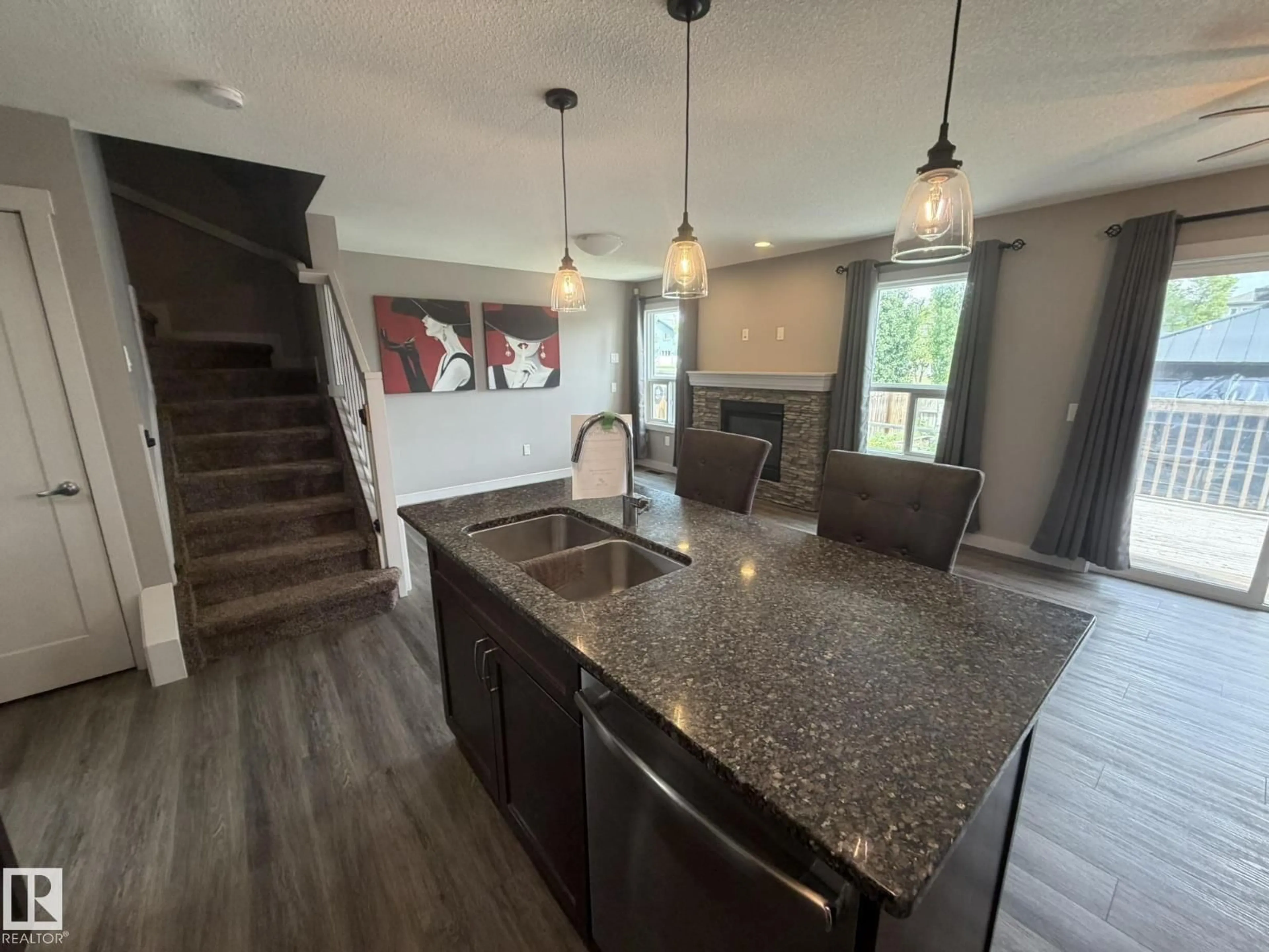 Open concept kitchen, unknown for 6821 EVANS WD NW, Edmonton Alberta T6M0T3