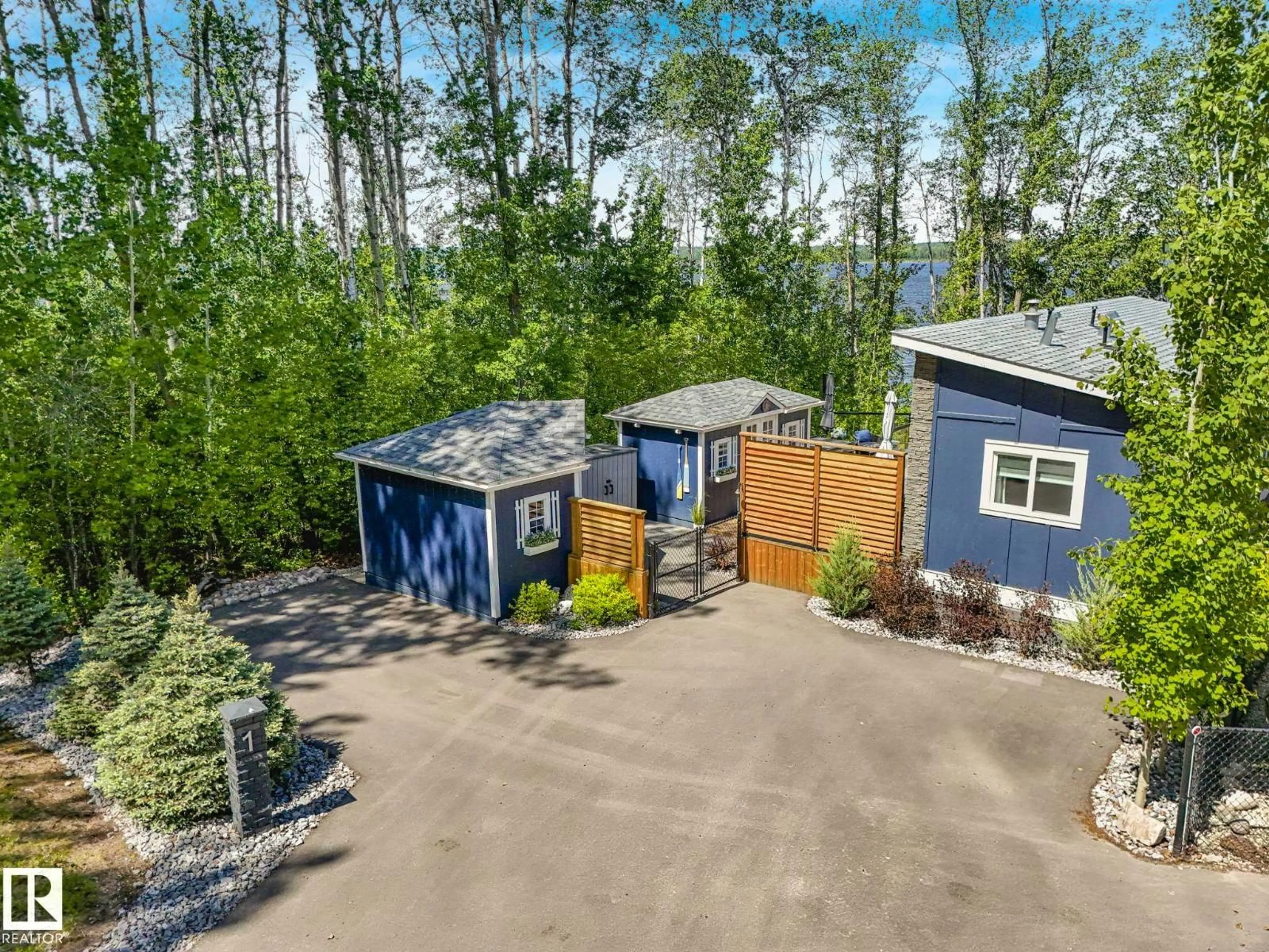 A pic from outside/outdoor area/front of a property/back of a property/a pic from drone, forest/trees view for 53509 RGE ROAD 60, Rural Parkland County Alberta T0E0W0