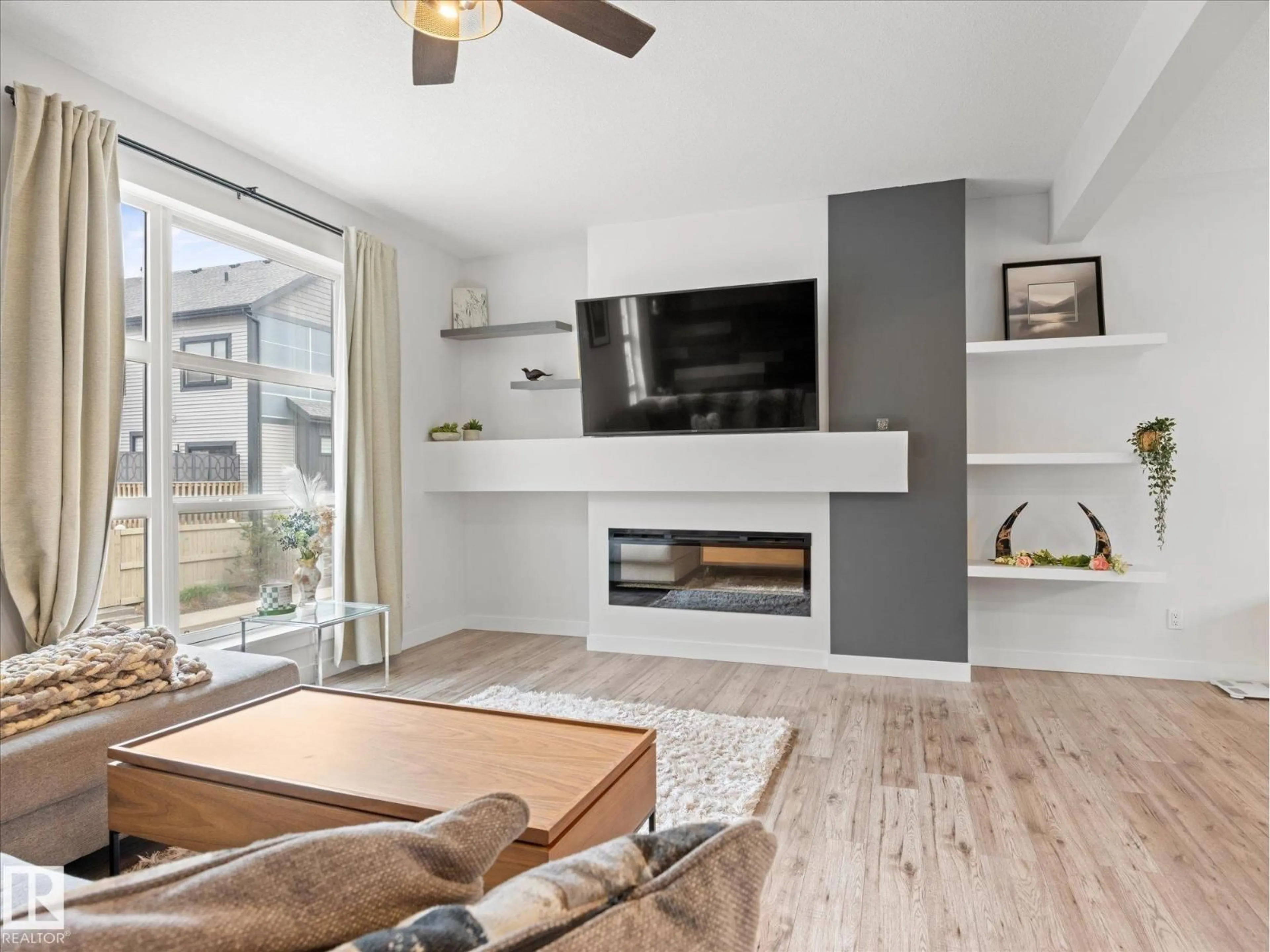Living room with furniture, wood/laminate floor for 14715 - 27 125 ST, Edmonton Alberta T5X0G8
