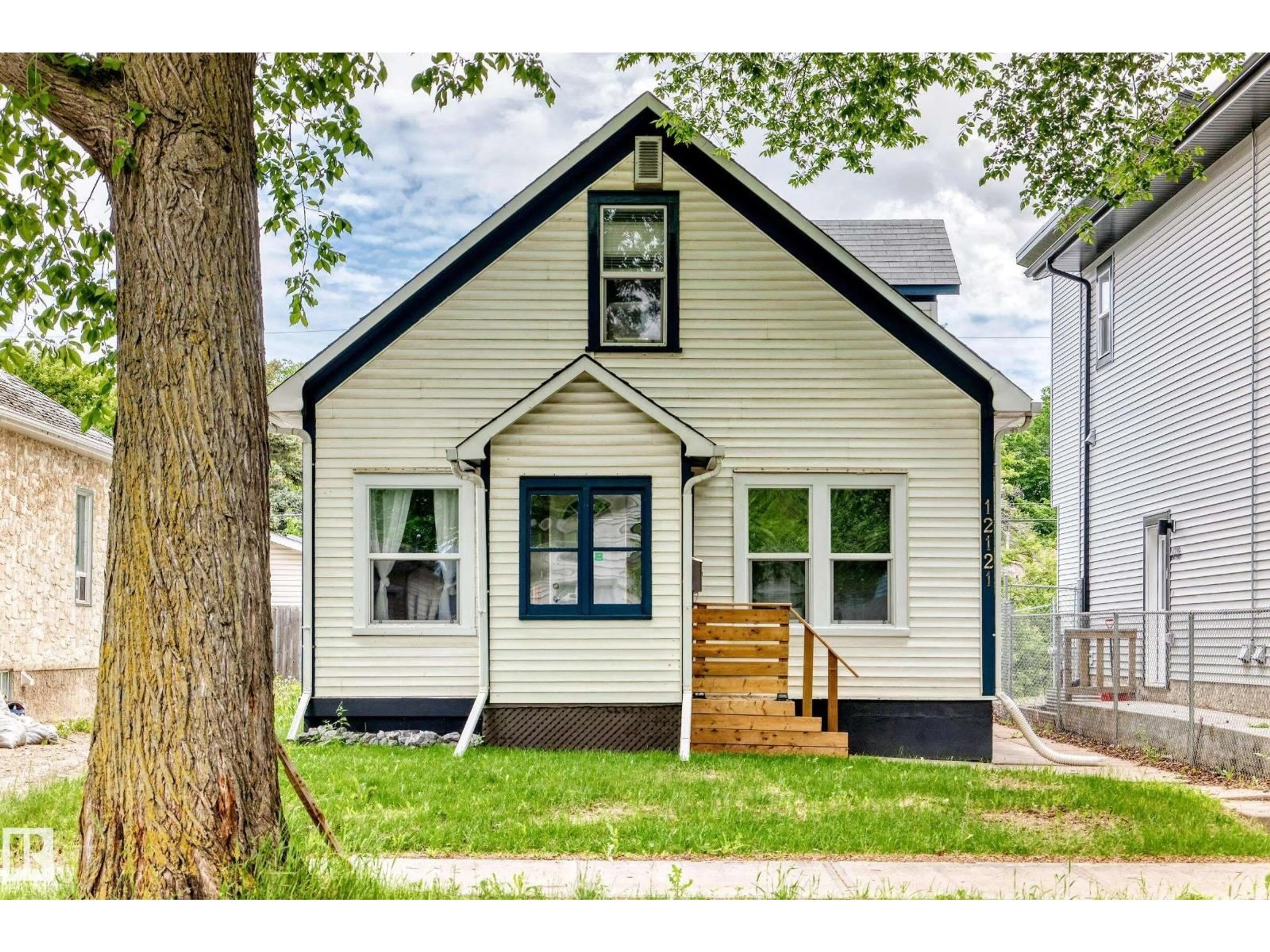 Home with vinyl exterior material, street for NW - 12121 64 ST, Edmonton Alberta T5W4J8