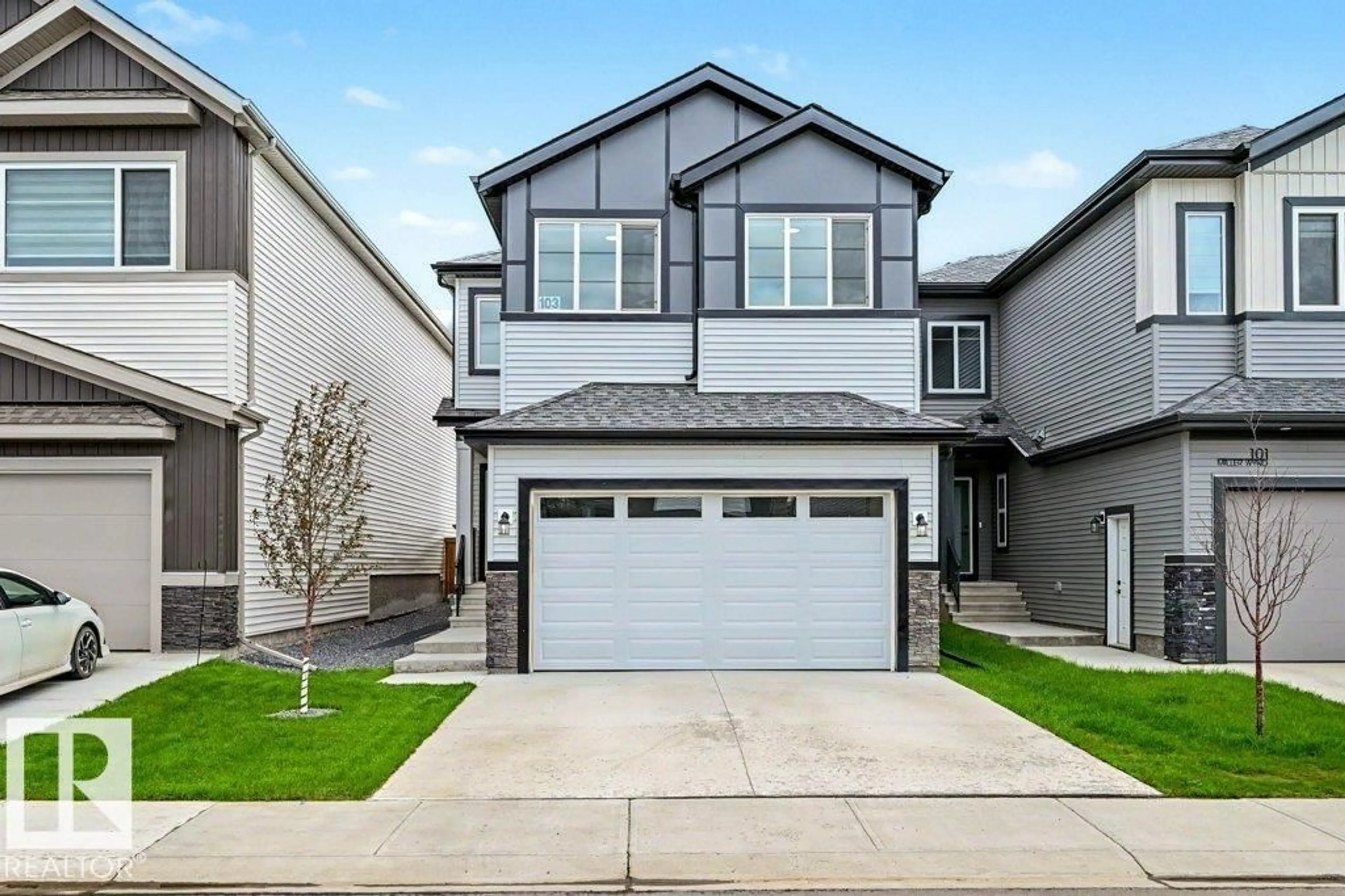 Home with vinyl exterior material, street for 103 MILLER WD, Leduc Alberta T9E1R7