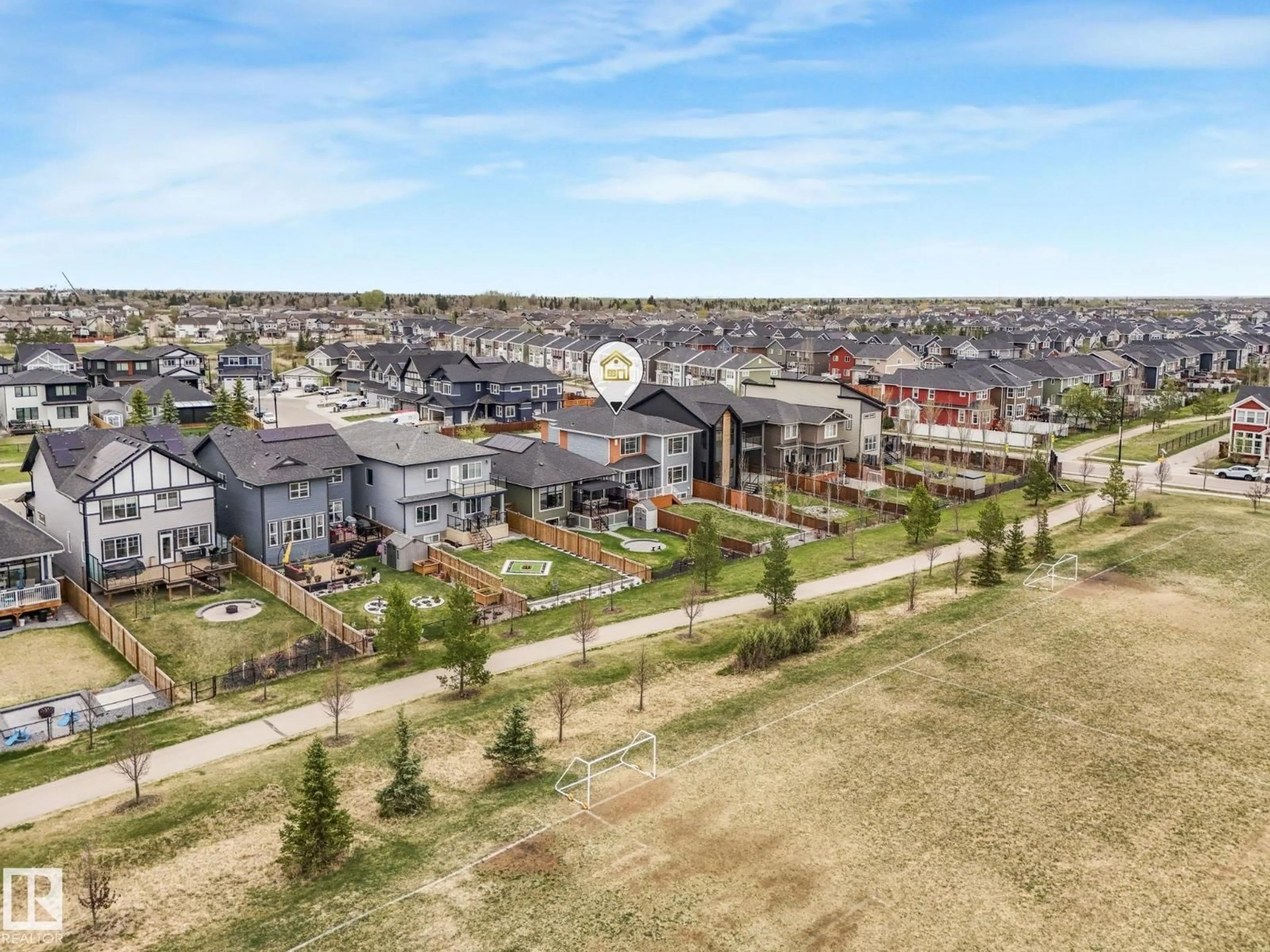 A pic from outside/outdoor area/front of a property/back of a property/a pic from drone, mountain view for 106 EDGEWATER CI, Leduc Alberta T9E1K5