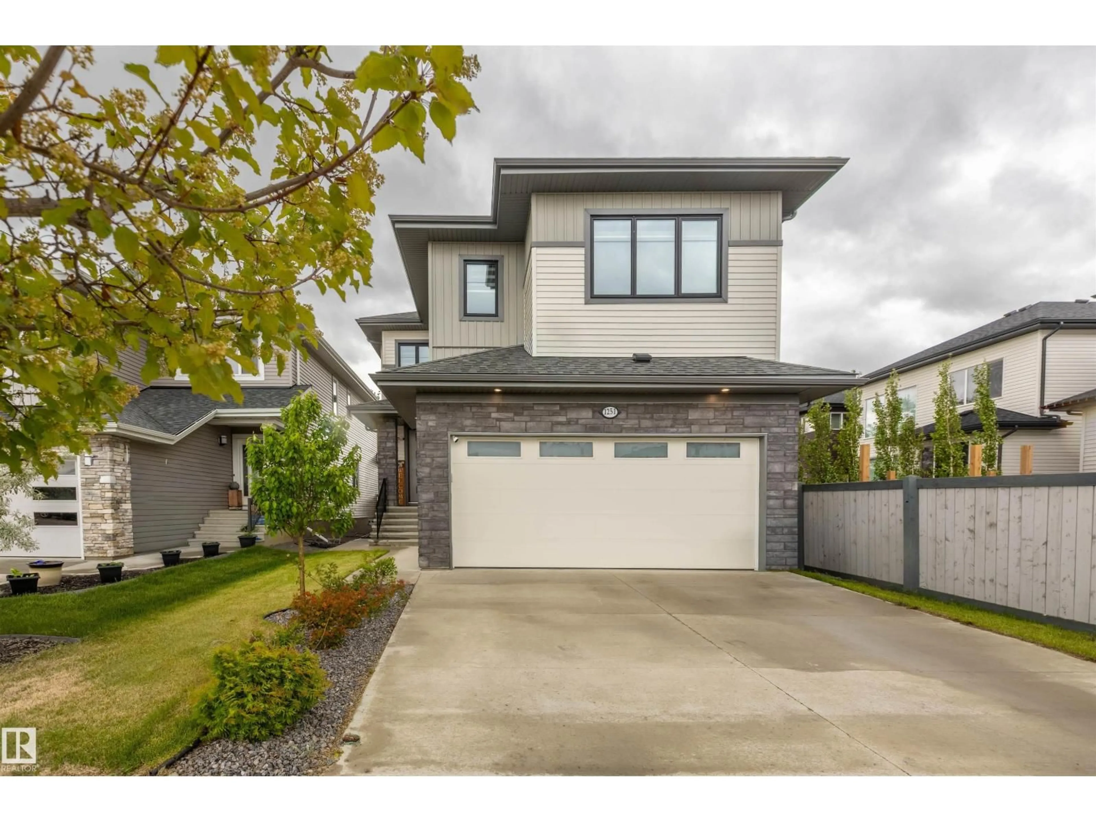 Home with vinyl exterior material, street for 1251 CALAHOO RD, Spruce Grove Alberta T7X0E8