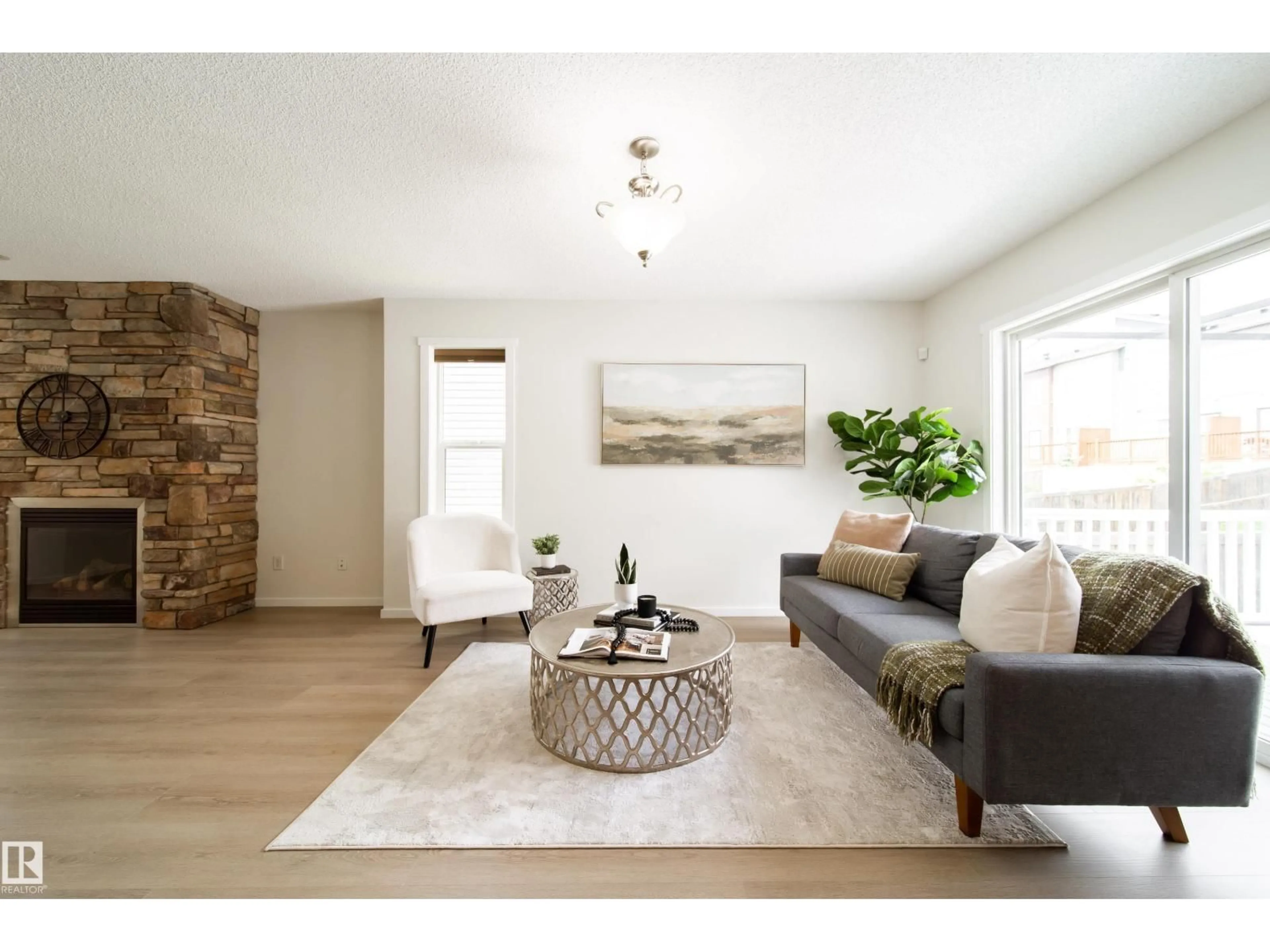 Living room with furniture, wood/laminate floor for 405 SIMMONDS WY, Leduc Alberta T9E0E6